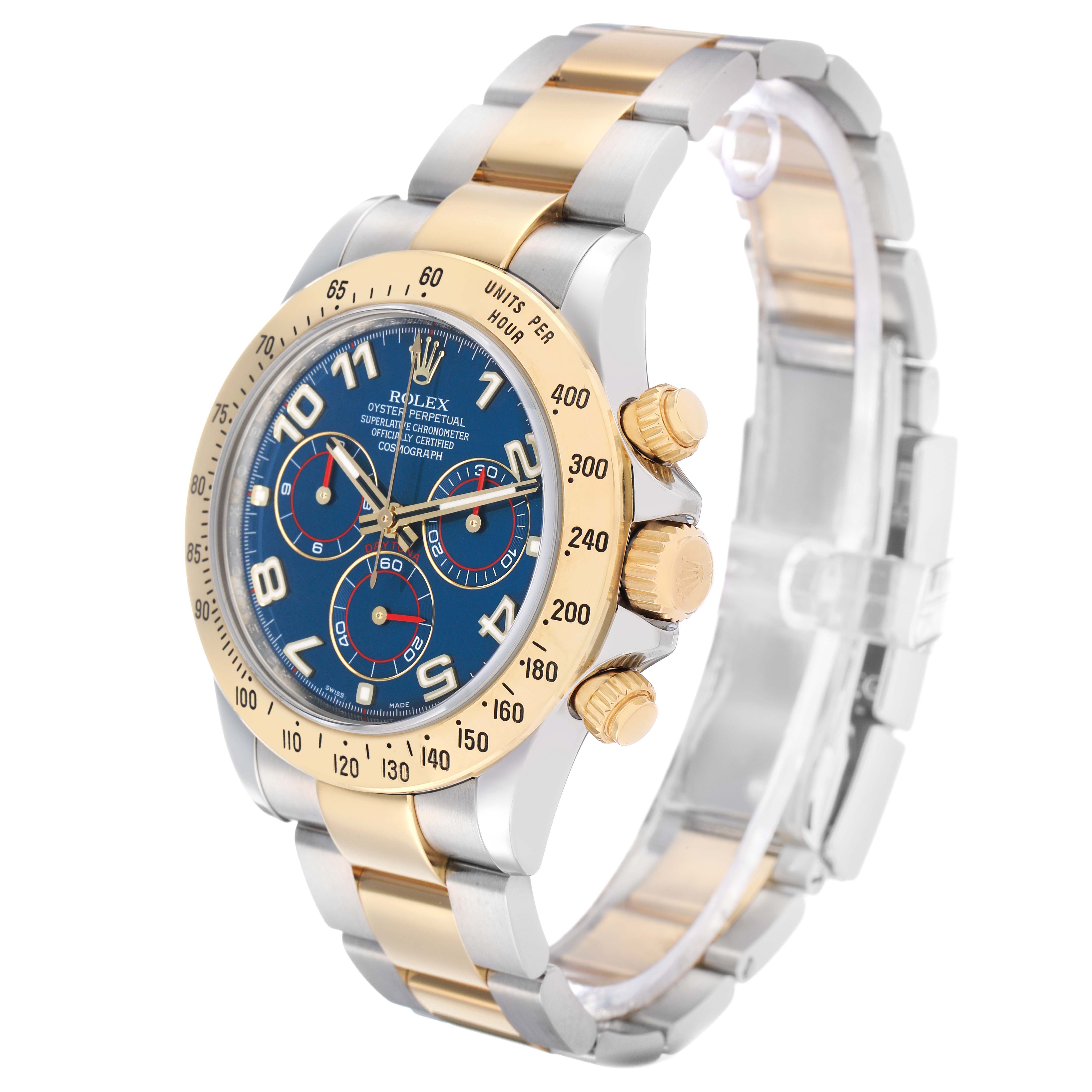 The Rolex Daytona 116523 Men's Steel and Gold (two tone) Blue Dial watch is shown at an angled side view, highlighting its bezel, crown, pushers, and bracelet.