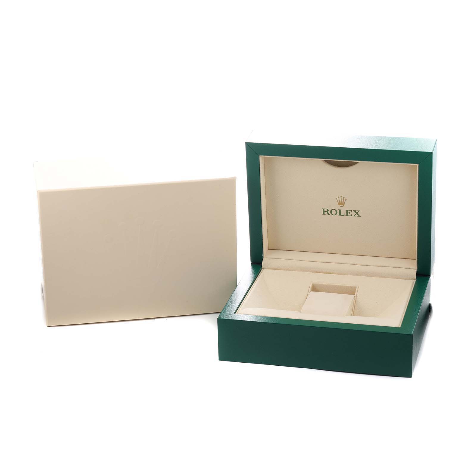 The image shows an open Rolex box for the Daytona model, displaying the interior and outer packaging at an angled view.