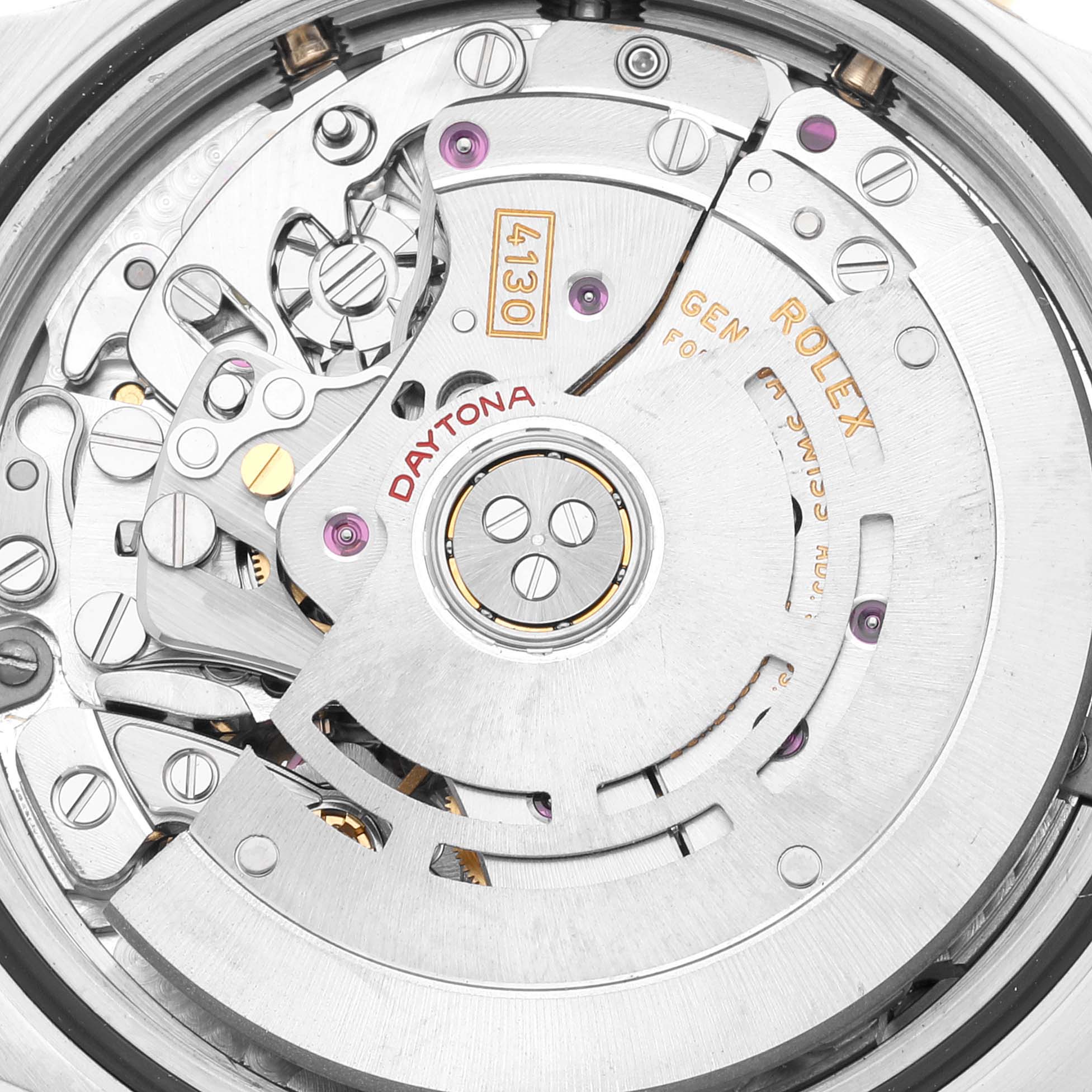 This image shows the movement mechanism, including gears and rotor, of a Rolex Daytona 116523 Men's Steel and Gold (two tone) Blue Dial 116523 Men's Steel and Gold (two tone) Blue Dial watch from a top-down angle.