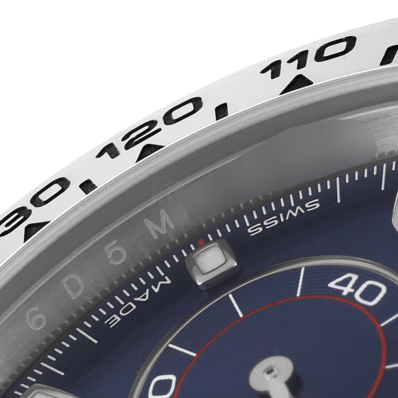 This image shows a close-up of the dial and outer bezel of the Rolex Daytona 116509 Men's White Gold Blue Dial 116509 Men's White Gold Blue Dial watch.