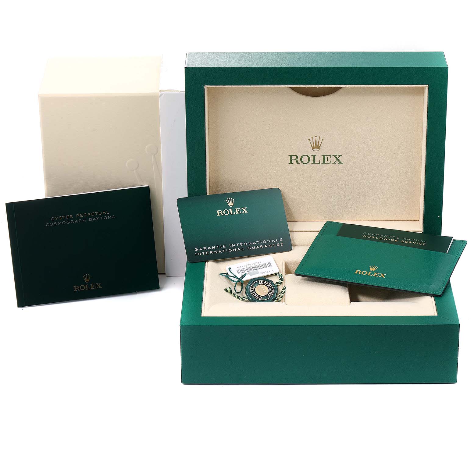 The image shows a Rolex Daytona 116509 Men's White Gold Blue Dial 116509 Men's White Gold Blue Dial packaging with a green box, international guarantee card, booklet, and tags.