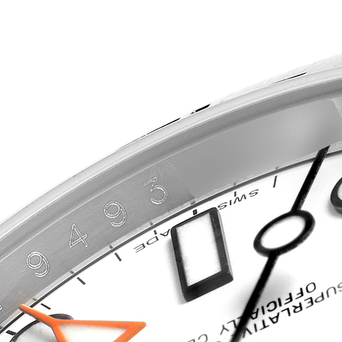 The image shows a close-up angle of the bezel, and part of the dial and hands of a Rolex Explorer 216570 Men
s Stainless Steel White Dial 216570 Men
s Stainless Steel White Dial watch.