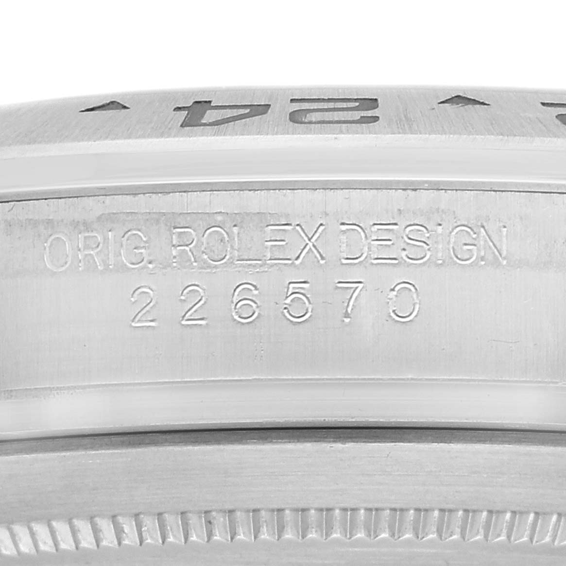 This image shows a close-up of the side of a Rolex Explorer 226570 Men
s Stainless Steel White Dial 226570 Men
s Stainless Steel White Dial watch, highlighting the "ORIG. ROLEX DESIGN" engraving and model number 226570.