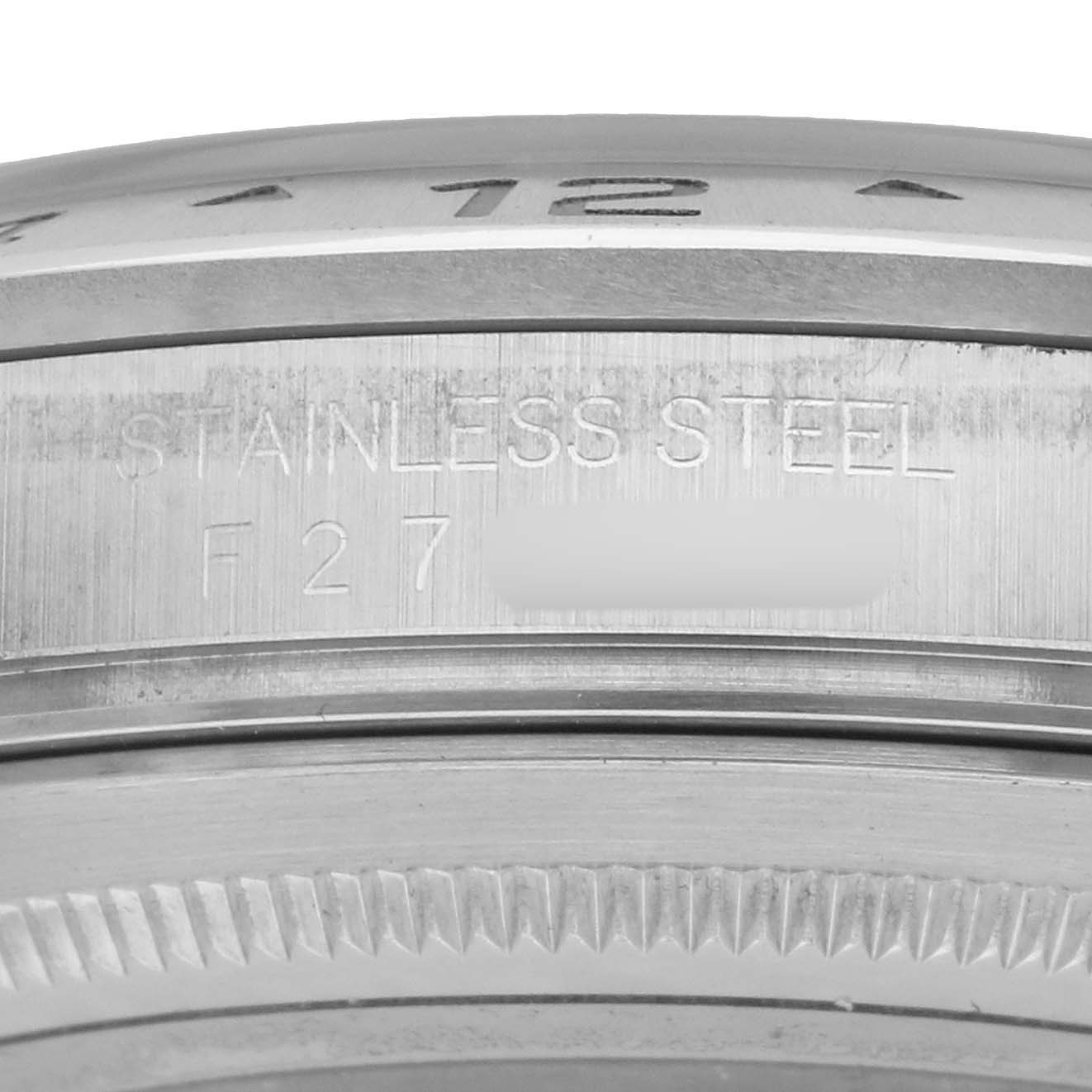 The image shows the side of a Rolex Explorer 16570 Men's Stainless Steel White Dial watch, highlighting the stainless steel engraving on the case.