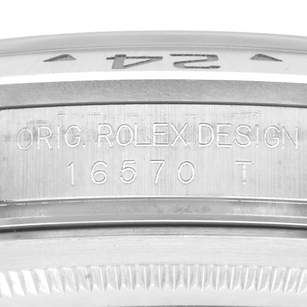 The image shows the side profile of a Rolex Explorer 16570 Men's Stainless Steel White Dial, focusing on the bezel with engraved model number "16570 T."