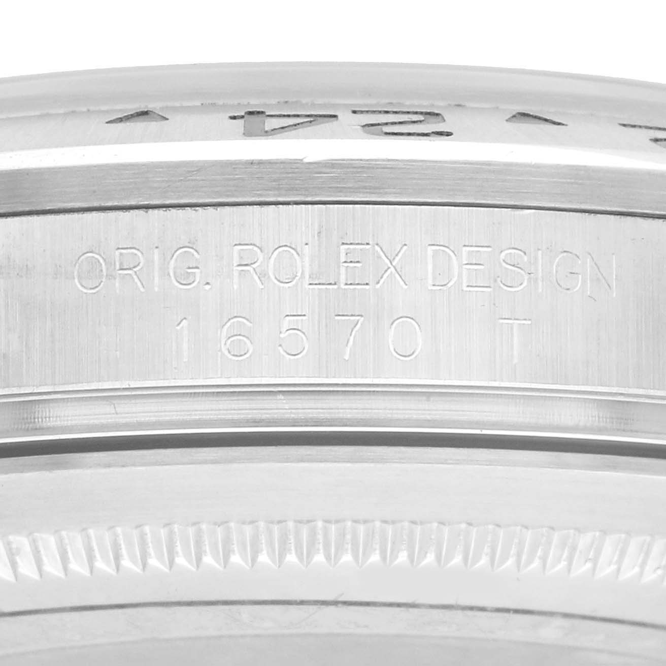 The image shows the engraved side of the bezel on a Rolex Explorer 16570 Men's Stainless Steel White Dial model, displaying the model number "16570 T" and "Orig. Rolex Design."