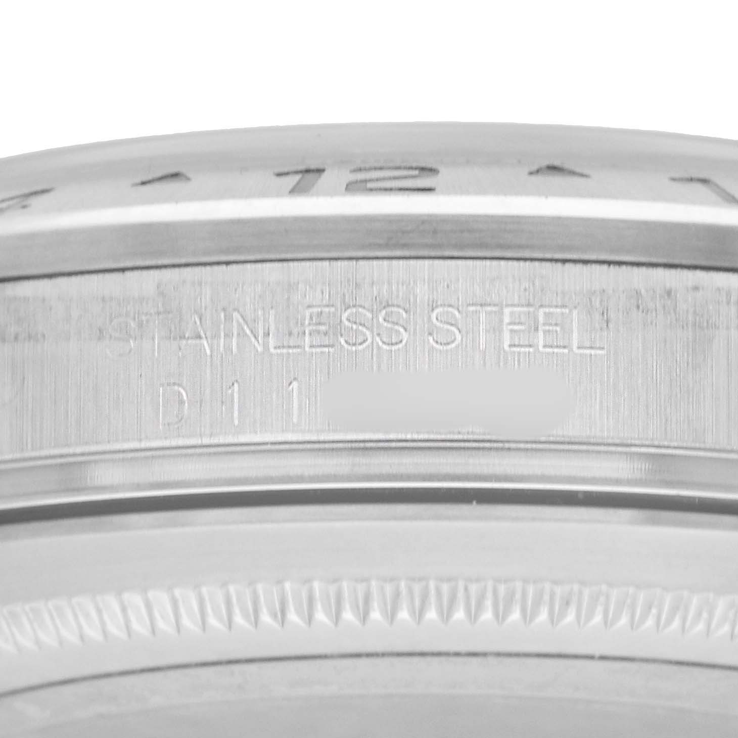 This image shows a close-up of the stainless steel bezel and markings on a Rolex Explorer 16570 Men's Stainless Steel White Dial watch.