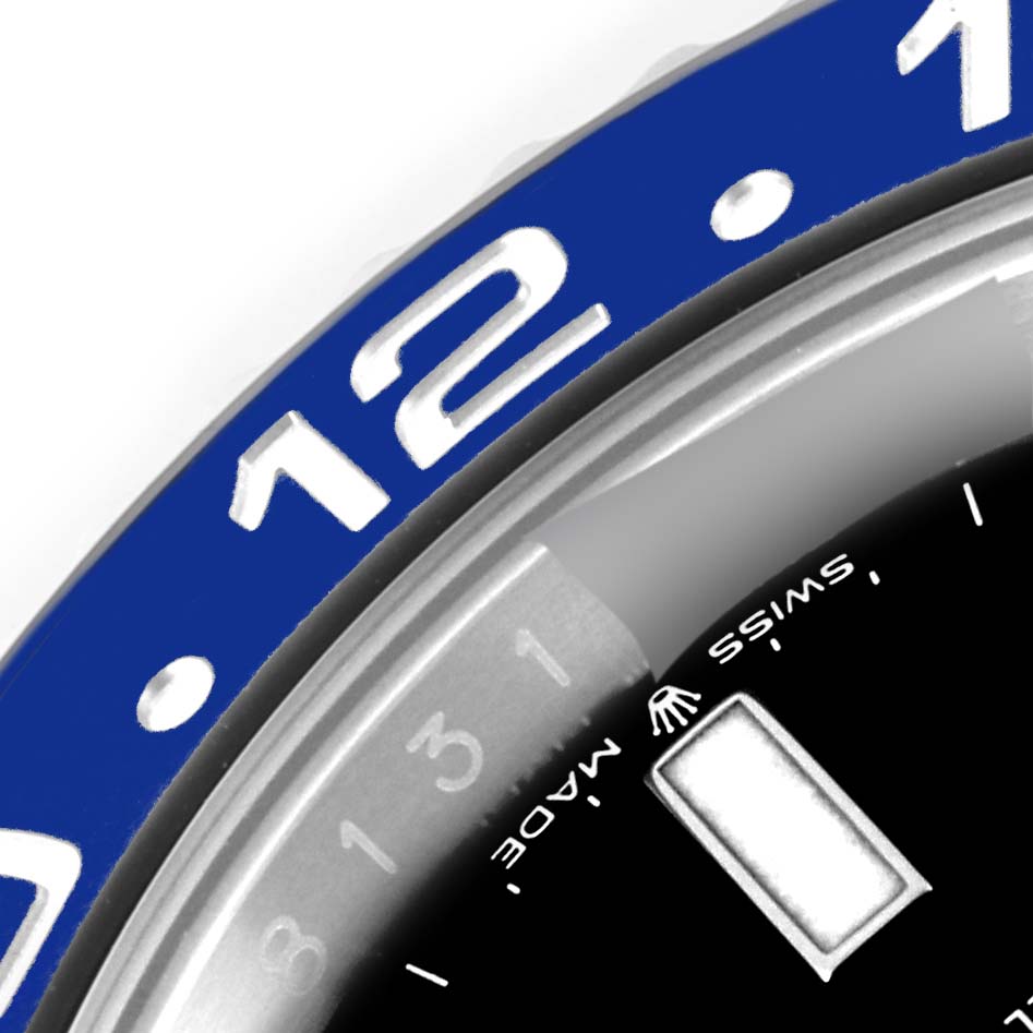 This image shows a close-up of the Rolex GMT-Master 126710 Men
s Stainless Steel Black Dial 126710 Men
s Stainless Steel Black Dial bezel and a portion of the dial.