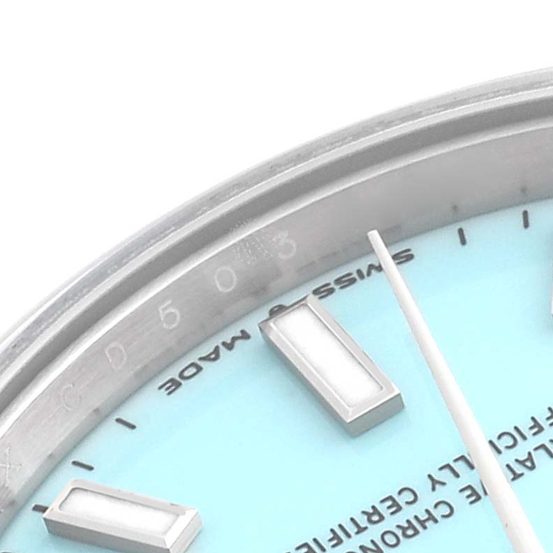 The image shows a close-up of the dial and bezel on a Mid-Size Rolex watch.