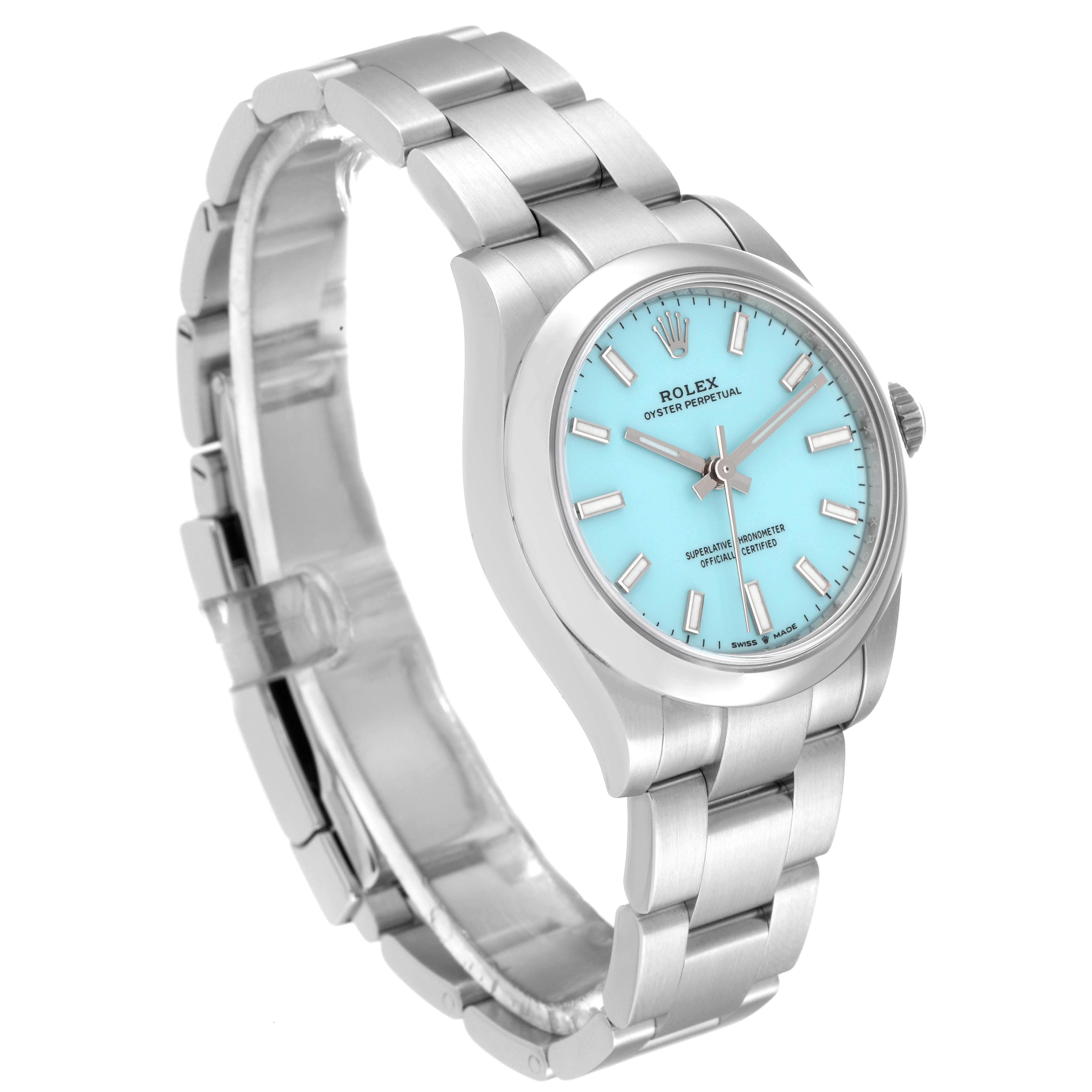 The image shows a Rolex Oyster Perpetual Mid-Size watch at an oblique angle, displaying its bracelet, case, and turquoise dial.