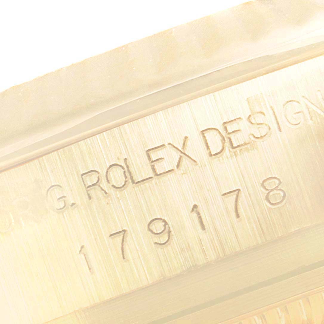 This close-up image shows the model number engraving on the case of a Rolex President 179178 Women's Yellow Gold White Dial 179178 Women's Yellow Gold White Dial watch.