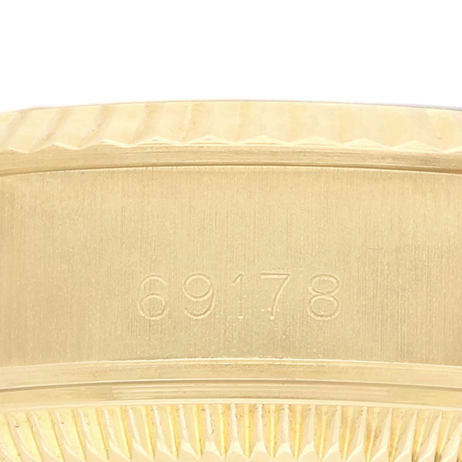 The image shows a close-up of the side of a Rolex President 69178 Women's Yellow Gold Champagne Dial model, highlighting the reference number 69178 on the gold case.