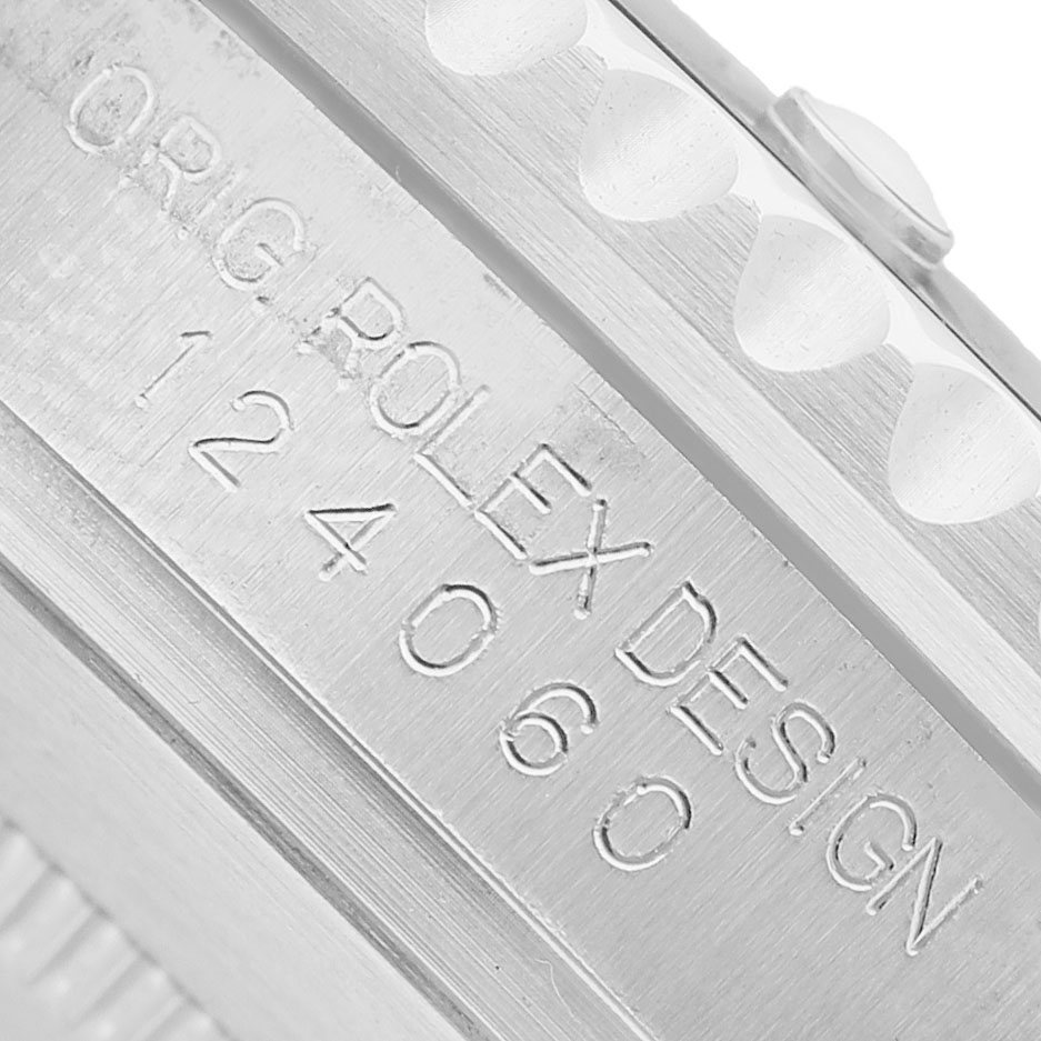 The image shows a close-up of the case side detailing and model number of a Rolex Submariner 124060 Men's Stainless Steel Black Dial.