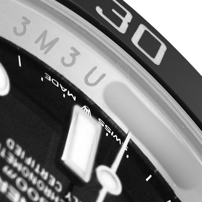 The image shows a close-up of the bezel and dial edge of a Rolex Submariner 124060 Men's Stainless Steel Black Dial, highlighting the minute markings and "SWISS MADE" text.