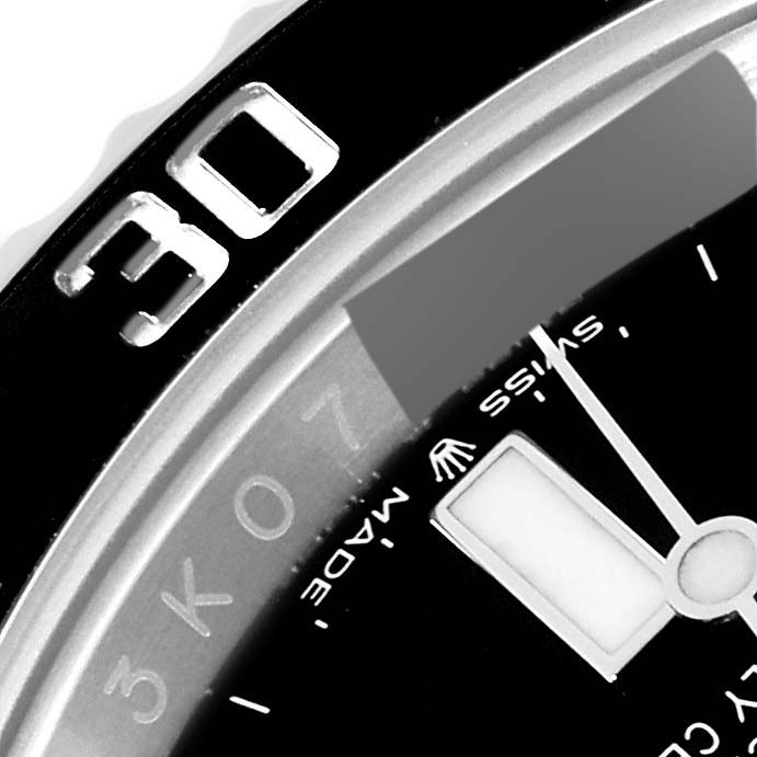 This close-up image shows the dial, bezel, and minute hand of a Rolex Submariner 124060 Men
s Stainless Steel Black Dial 124060 Men
s Stainless Steel Black Dial watch.