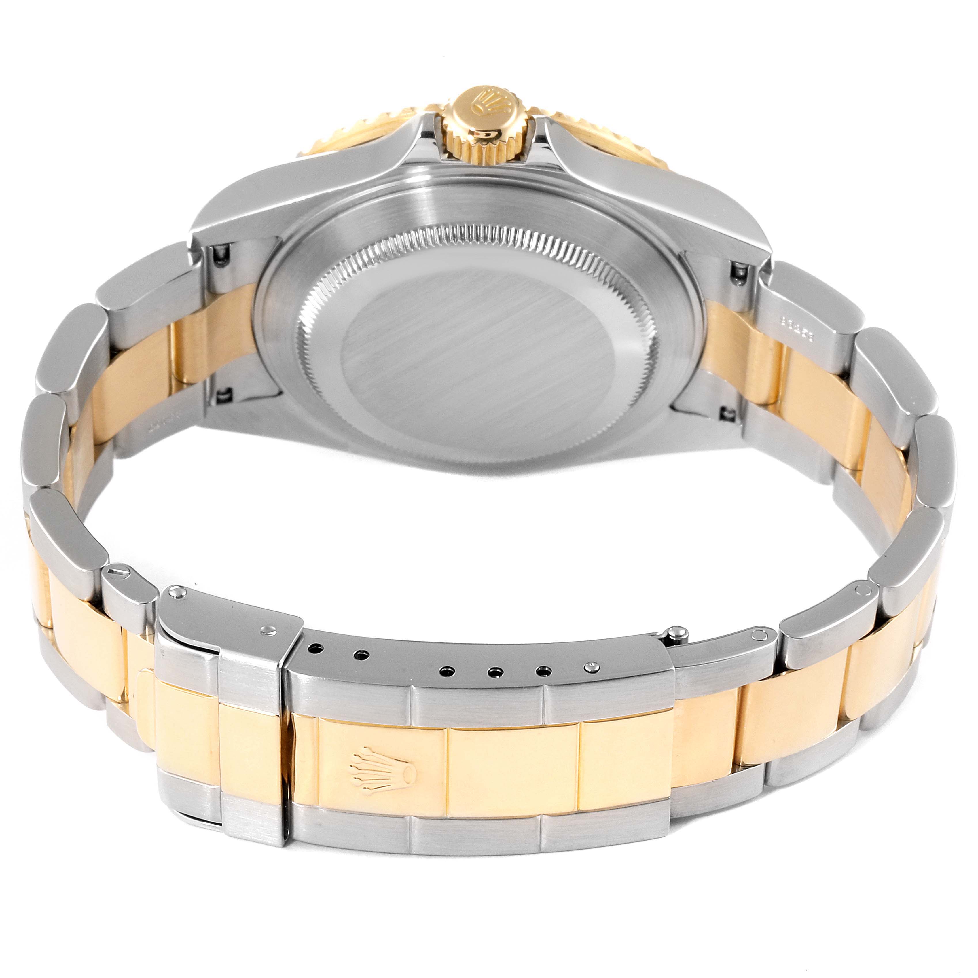 The image shows the back case, clasp, and part of the bracelet of a Rolex Submariner 16613 Men's Steel and Gold (two tone) Champagne Dial 16613 Men's Steel and Gold (two tone) Champagne Dial watch.