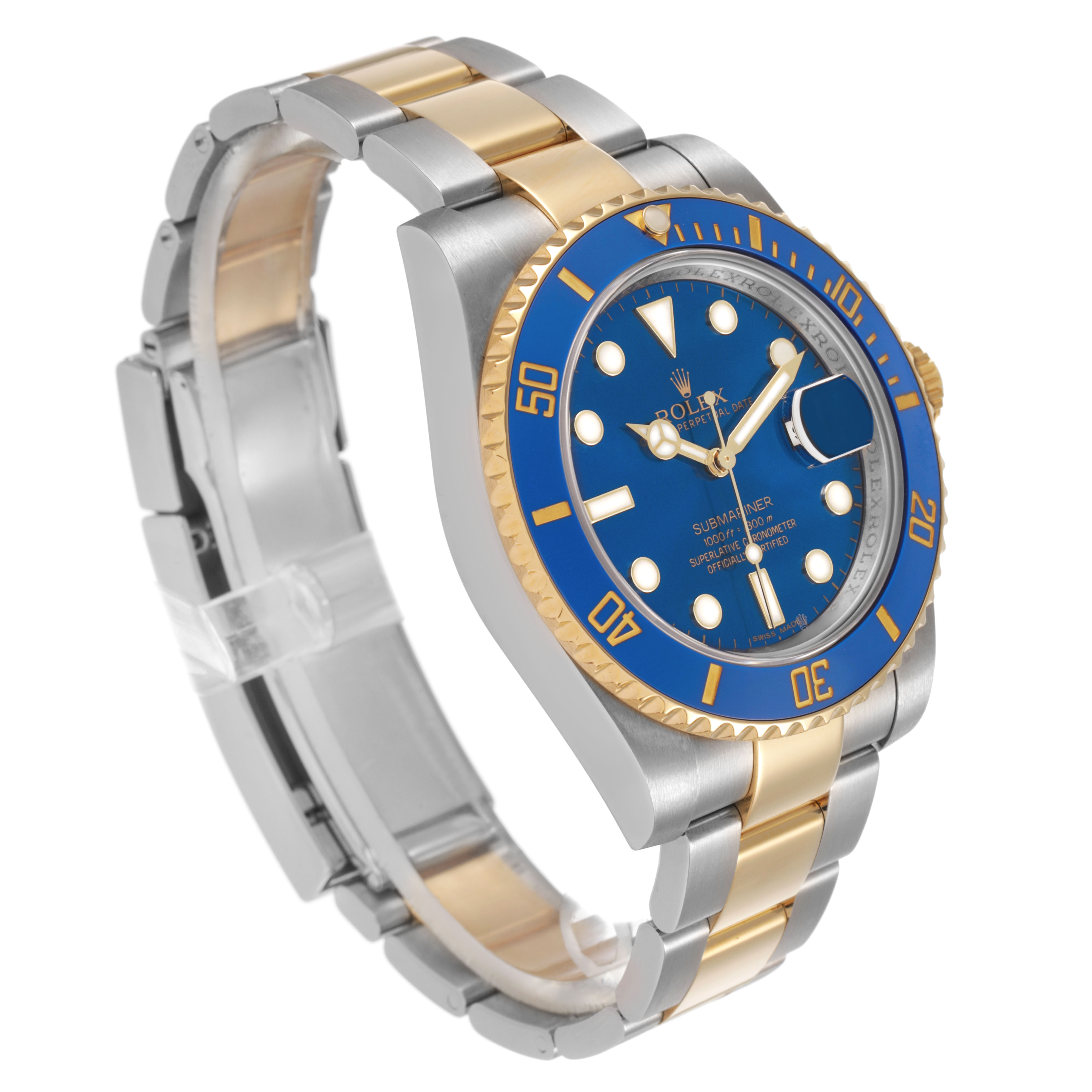 The Rolex Submariner 116613 Men's Steel and Gold (two tone) Blue Dial watch is shown at a three-quarter angle, highlighting its blue dial, bezel, and two-tone bracelet.