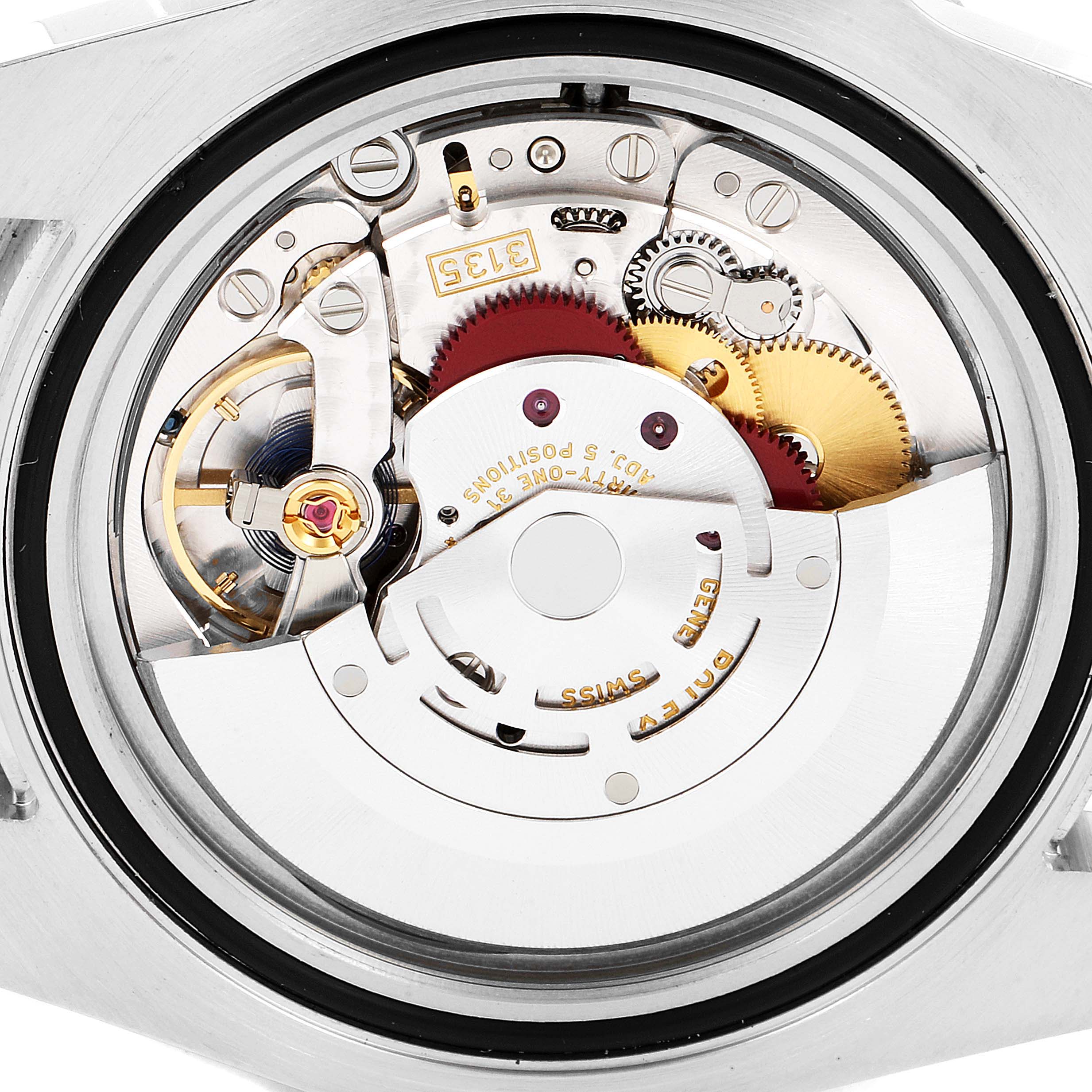 The image shows the internal mechanism from the back of a Rolex Submariner 116613 Men's Steel and Gold (two tone) Blue Dial 116613 Men's Steel and Gold (two tone) Blue Dial watch, displaying gears and components.