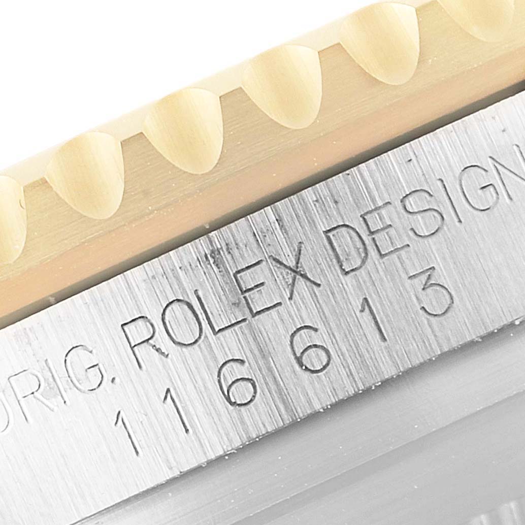 This image shows a close-up of the bezel and engraved side of the Rolex Submariner 116613 Men's Steel and Gold (two tone) Blue Dial 116613 Men's Steel and Gold (two tone) Blue Dial model, highlighting the model number 116613.