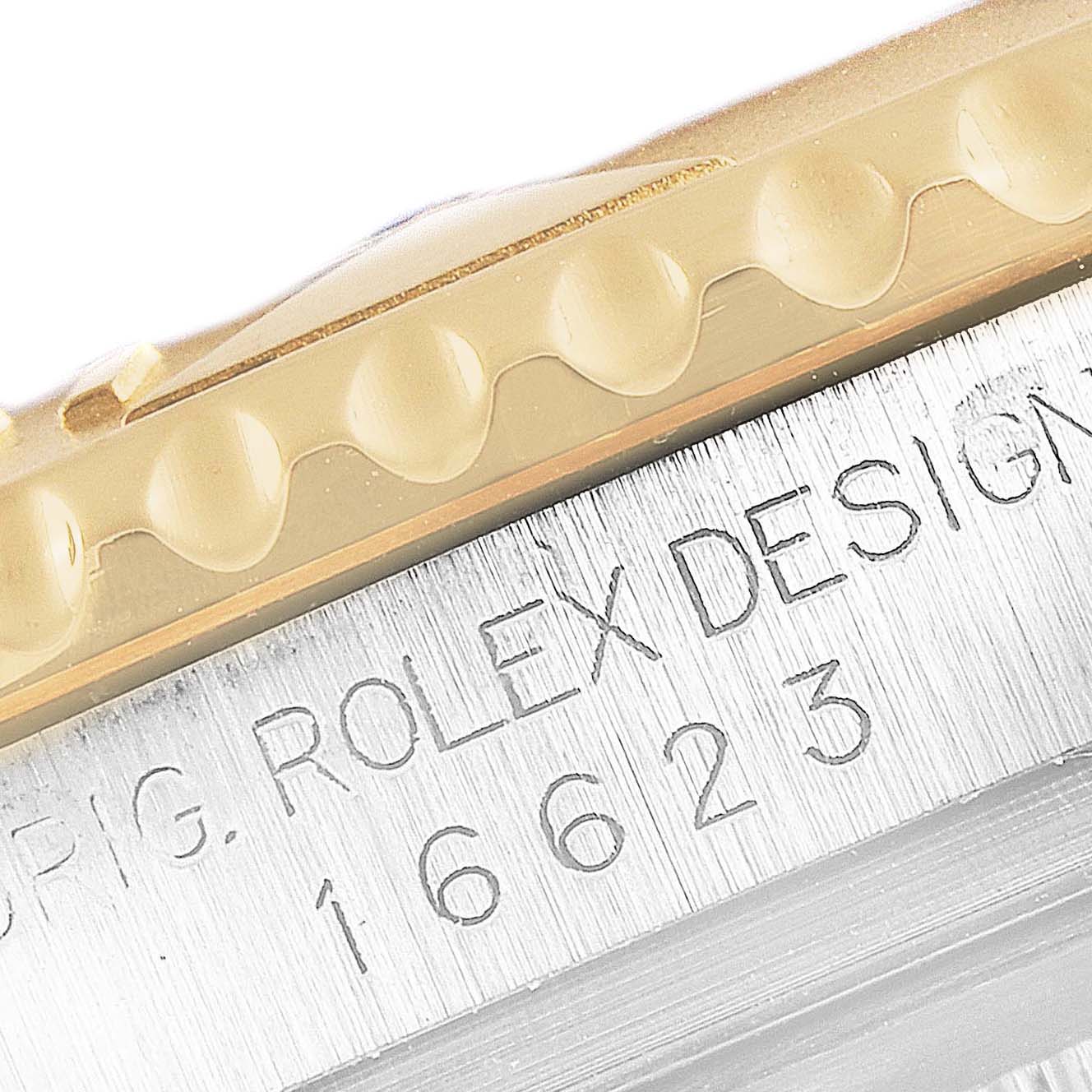 This image shows the edge of the bezel and the engraved model number of a Rolex Yacht-Master 16623 Men
s Steel and Gold (two tone) Blue Dial 16623 Men
s Steel and Gold (two tone) Blue Dial watch.