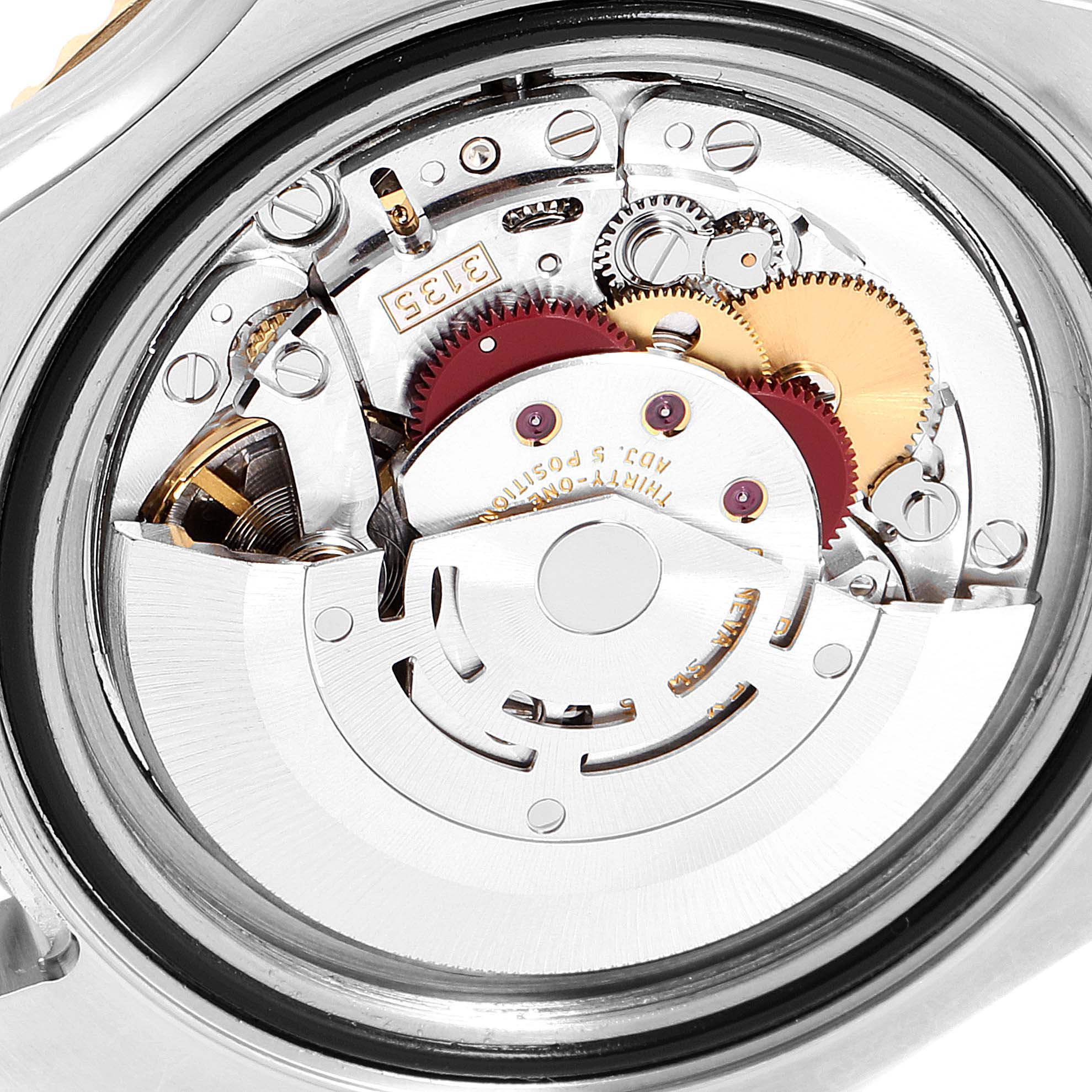 This image shows the internal mechanical movement of the Rolex Yacht-Master 16623 Men
s Steel and Gold (two tone) Blue Dial 16623 Men
s Steel and Gold (two tone) Blue Dial watch from a close-up, case-back removed view.