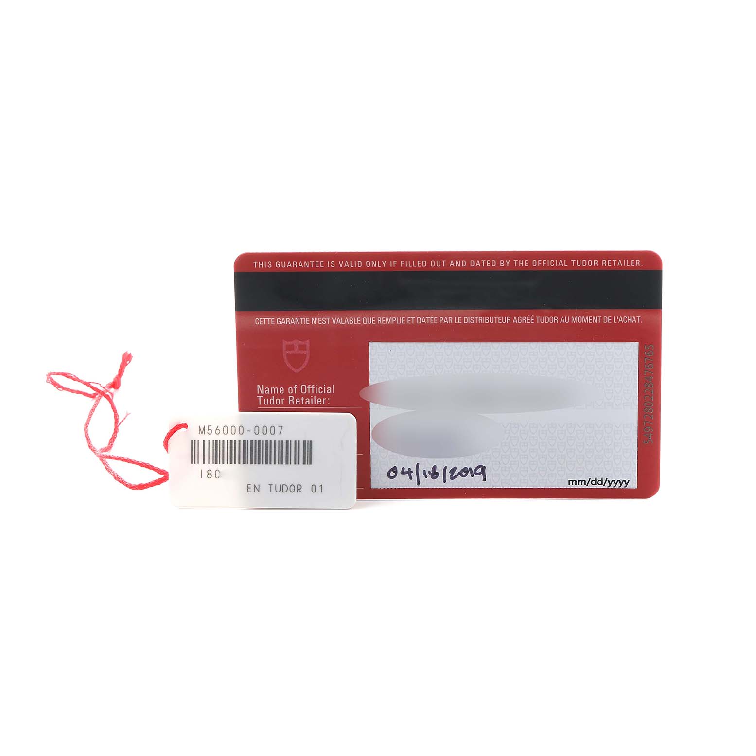 The image shows a warranty card and tag for a Tudor Glamour 56000 Men's Stainless Steel Black Dial model, laying flat with text and date visible.