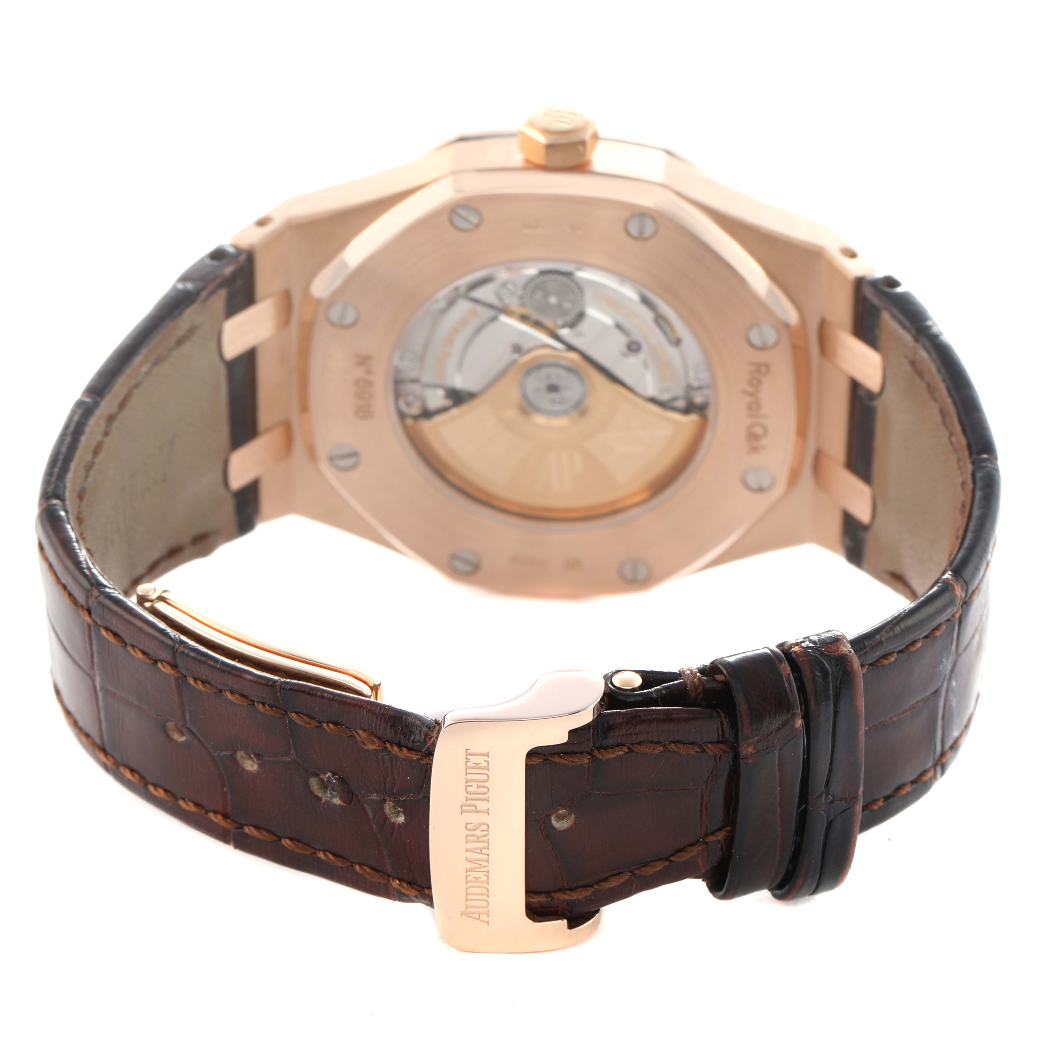 The Audemars Piguet Royal Oak 15400OR Men's Rose Gold Silver Dial watch is shown from a rear angle, highlighting the case back and leather strap.