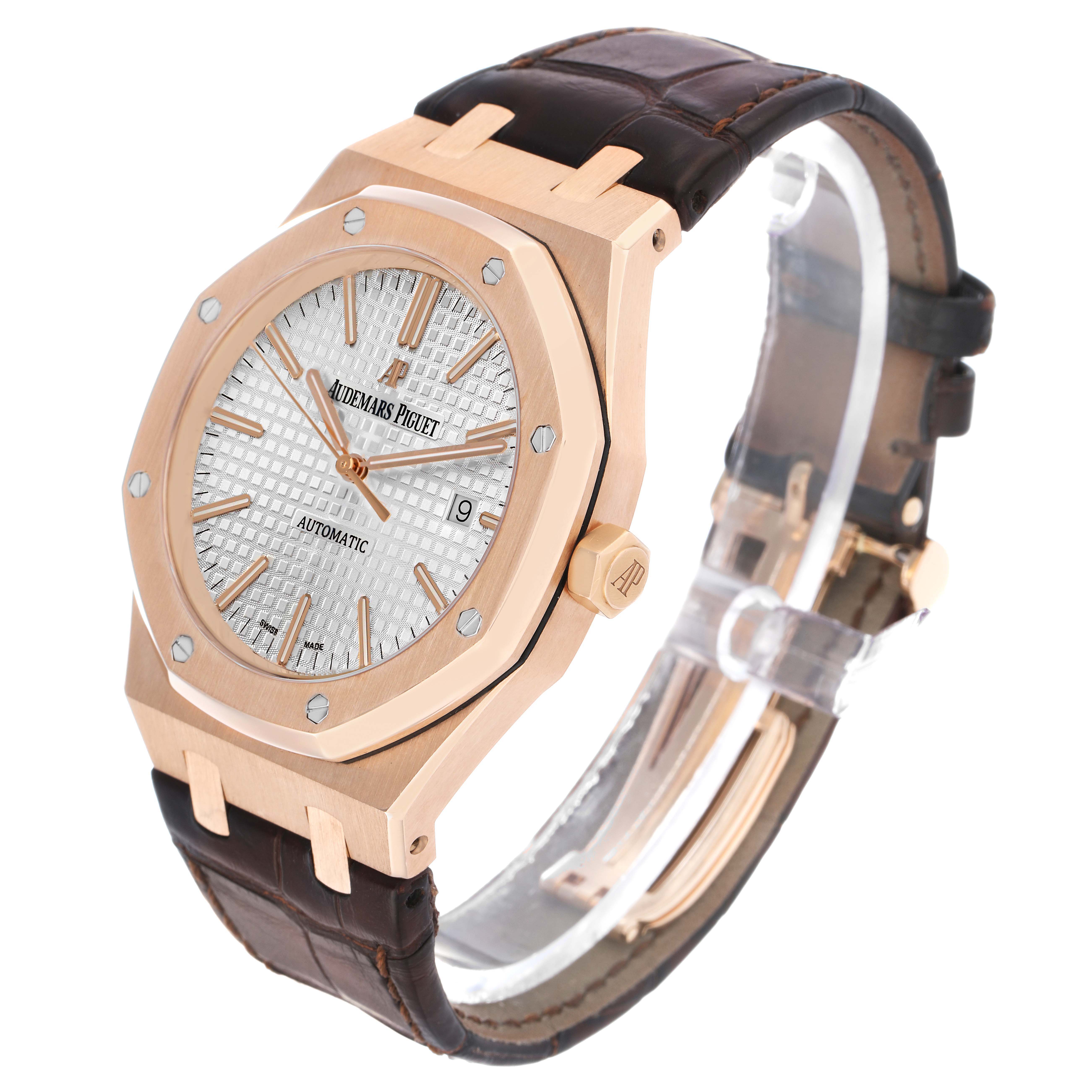 The Audemars Piguet Royal Oak 15400OR Men's Rose Gold Silver Dial is shown at an angled view, highlighting its rose gold case, textured dial, and leather strap.