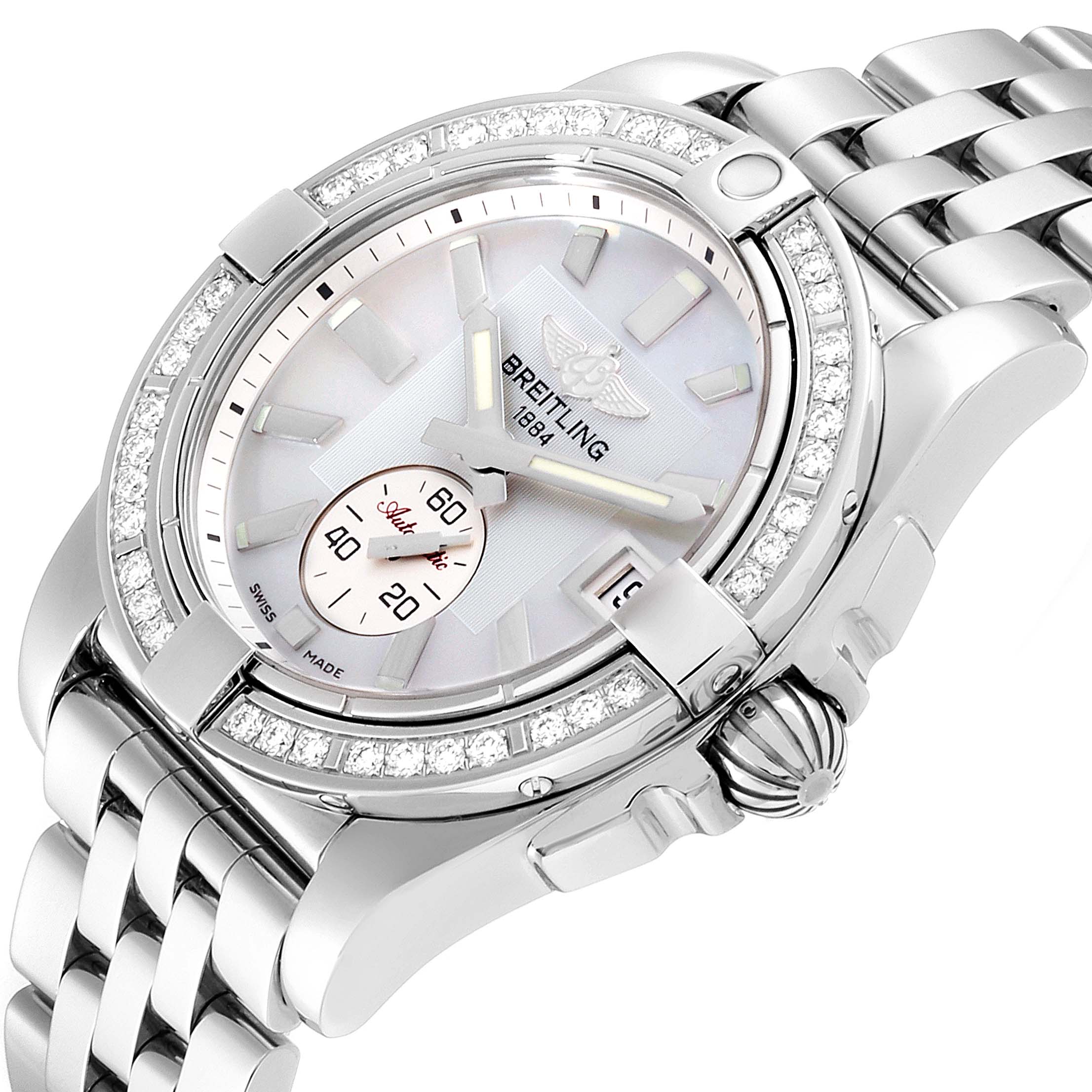 The image showcases a Breitling A37330 Women's Stainless Steel Mother of Pearl Dial A37330 Women's Stainless Steel Mother of Pearl Dial Galactic 36 Mother of Pearl Diamond Steel Ladies Watch A37330 from a slightly tilted angle, displaying the dial, crown, and part of the bracelet.