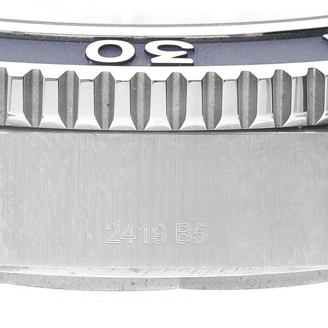 This image shows a close-up view of the bezel and brushed stainless steel case of a Breitling Superocean A17367 Men's Stainless Steel Blue Dial A17367 Men's Stainless Steel Blue Dial watch.