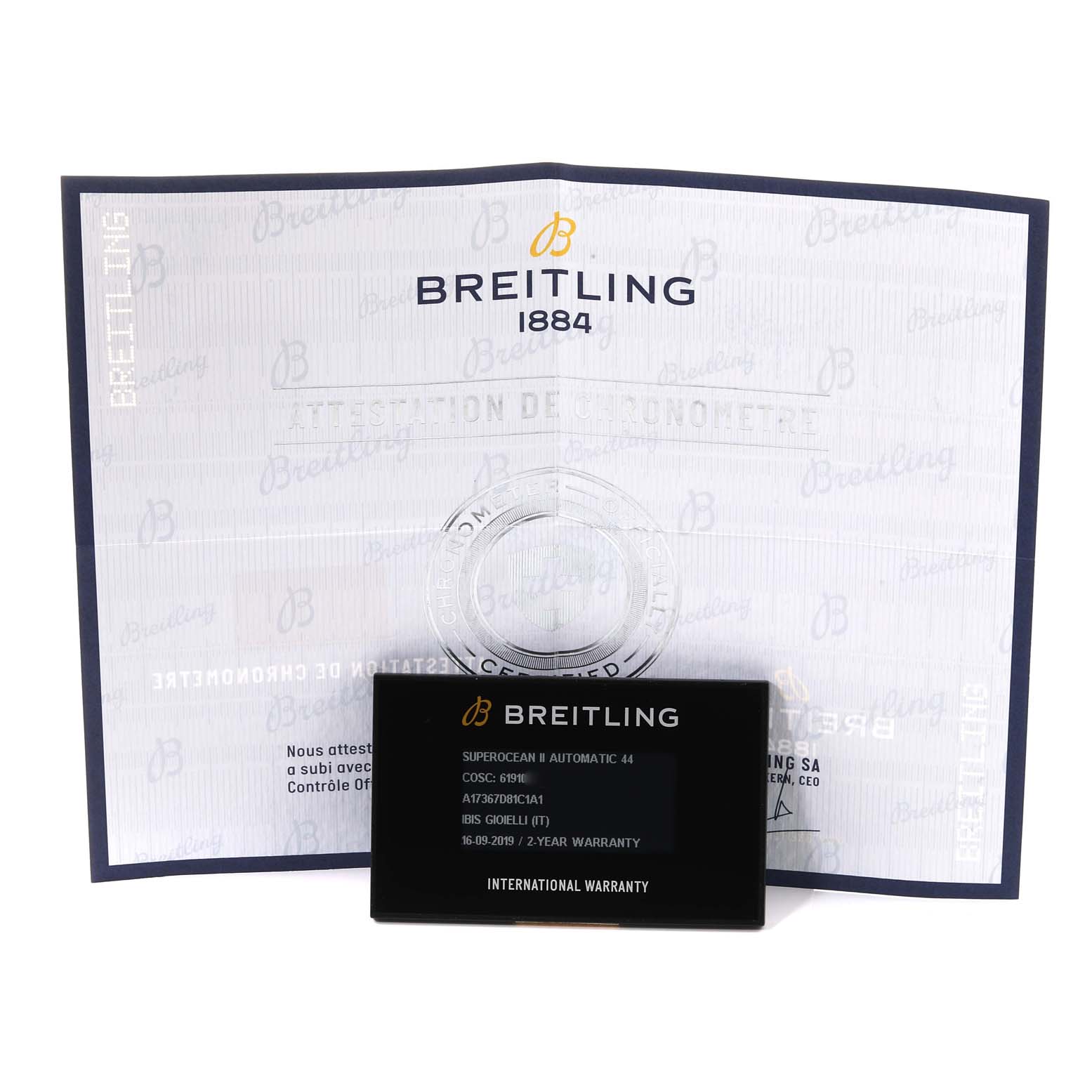 The image shows the Breitling Superocean A17367 Men's Stainless Steel Blue Dial A17367 Men's Stainless Steel Blue Dial model's warranty card and certificate, viewed from the front.