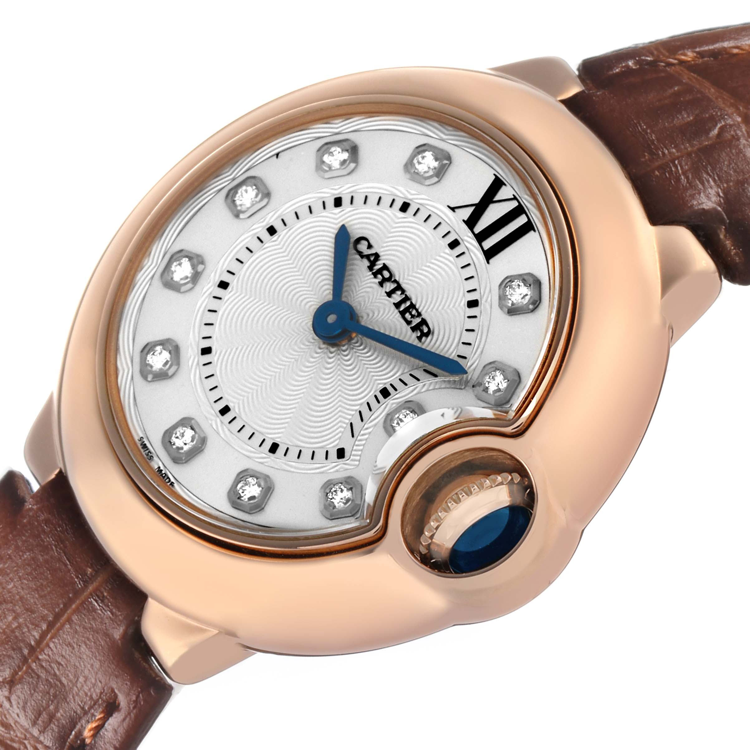 The Cartier Ballon Bleu WJBB0019 Women's Rose Gold Silver Dial watch is shown at an angle highlighting the dial, crown, and part of the leather strap.
