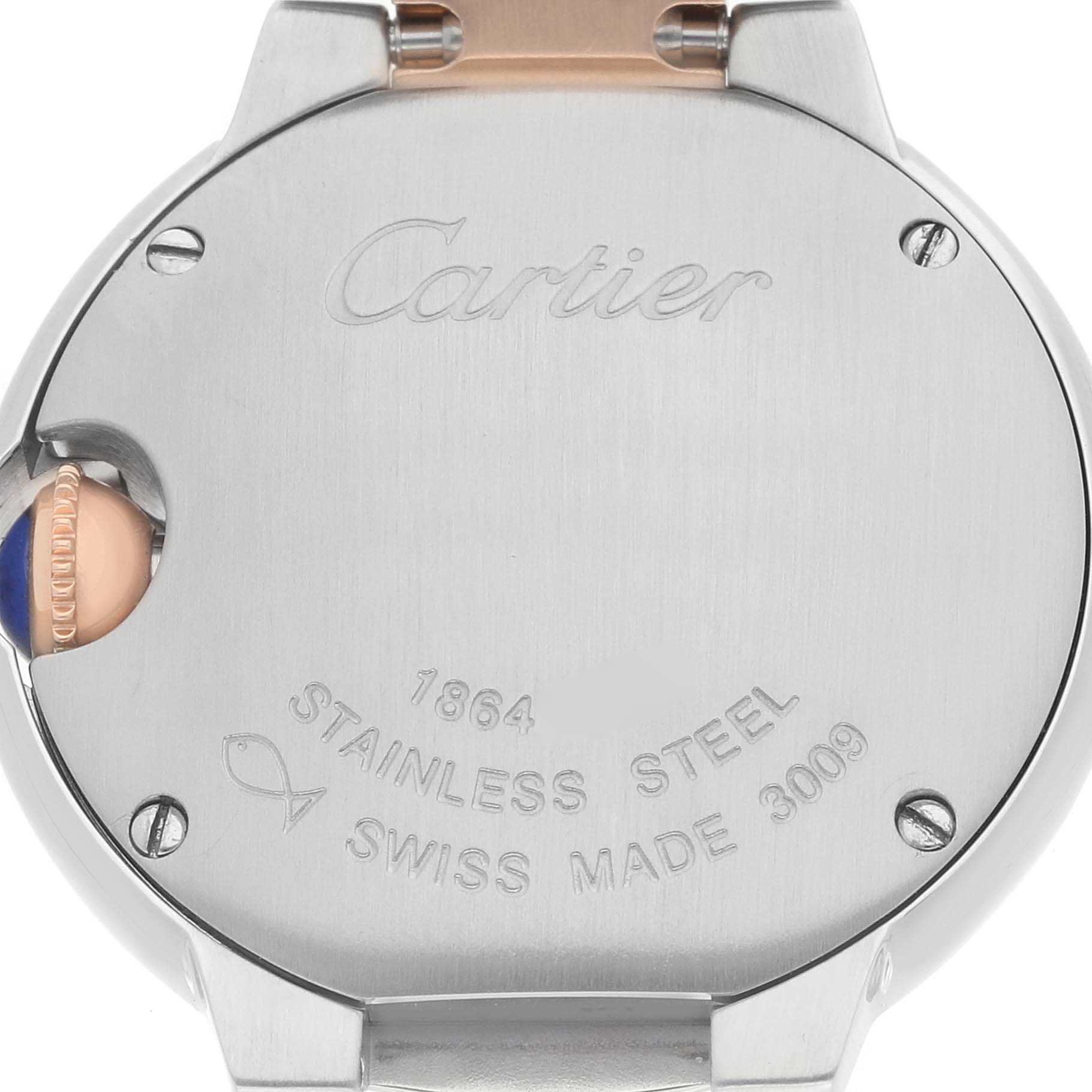 The image shows the back of a Ballon Bleu de Cartier watch, highlighting its stainless steel case and engravings.
