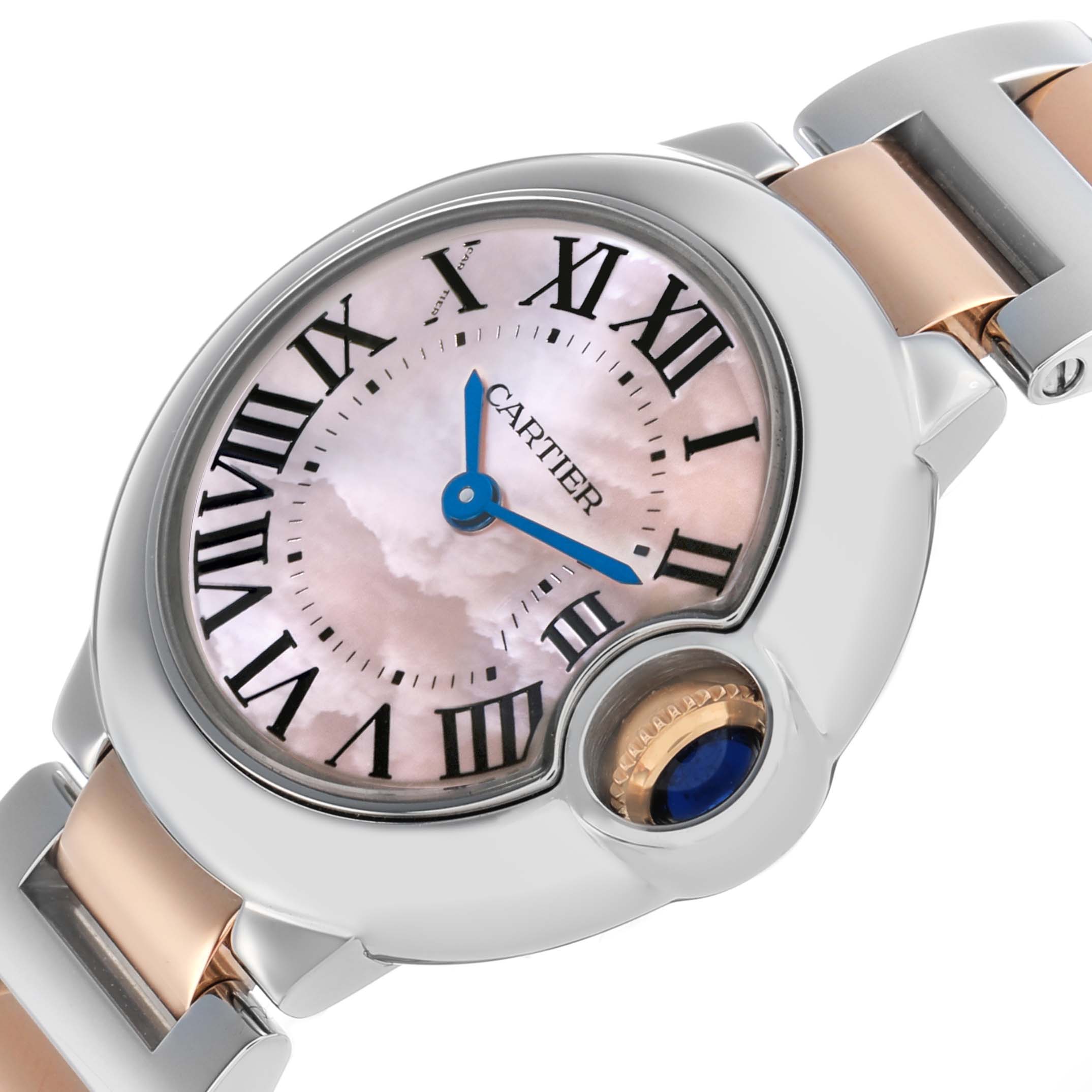 The Cartier Ballon Bleu W6920034 Women's Steel and Gold (two tone) Mother of Pearl Dial watch is shown at an angle, highlighting the face, crown with blue cabochon, and two-tone bracelet.