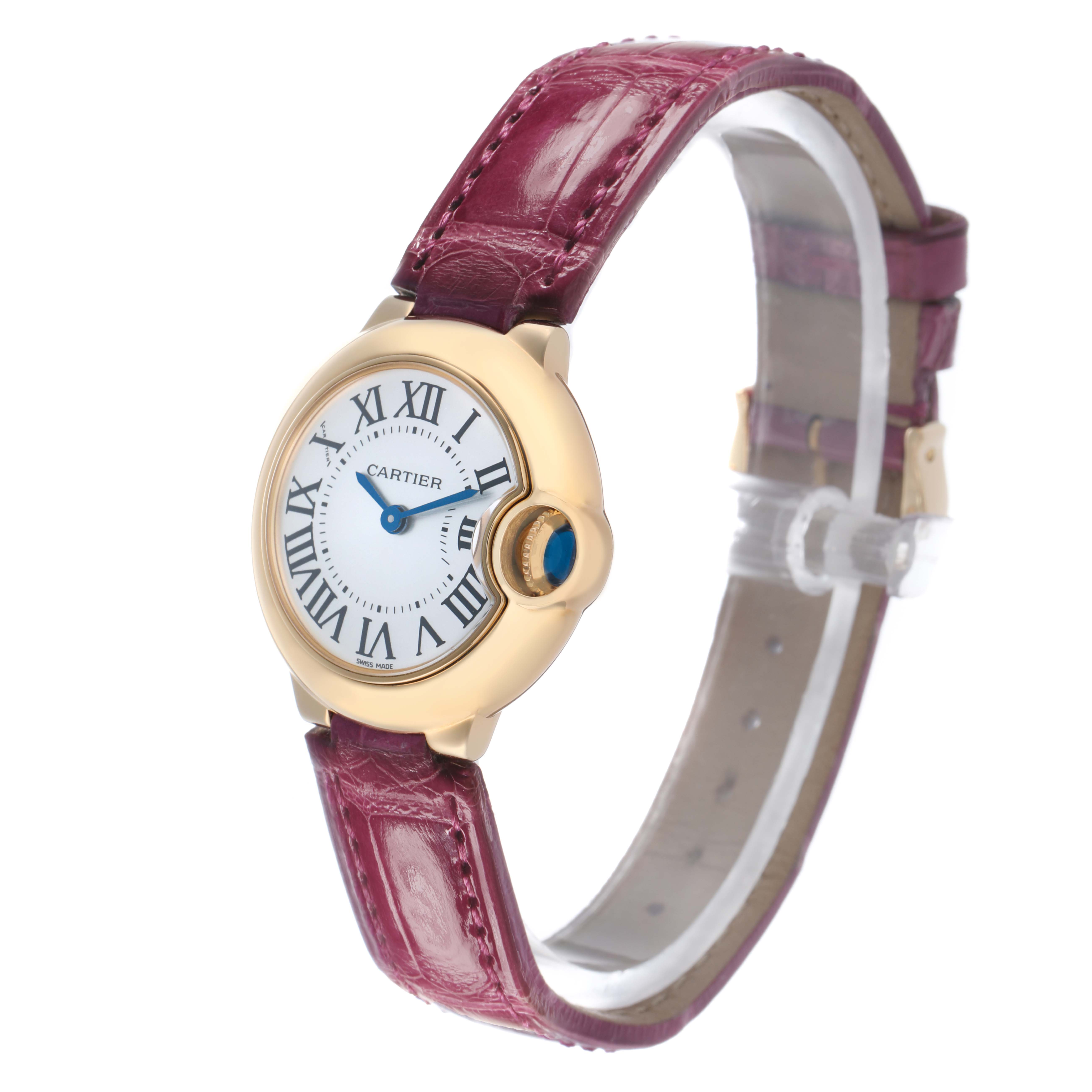 The Cartier Ballon Bleu W6900156 Women's Yellow Gold Silver Dial watch is shown at a three-quarter angle, displaying the face, crown, and burgundy leather strap.