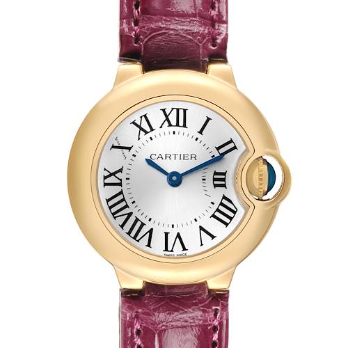 The Cartier Ballon Bleu W6900156 Women's Yellow Gold Silver Dial watch is shown from the front, highlighting its round face, Roman numerals, and pink strap.