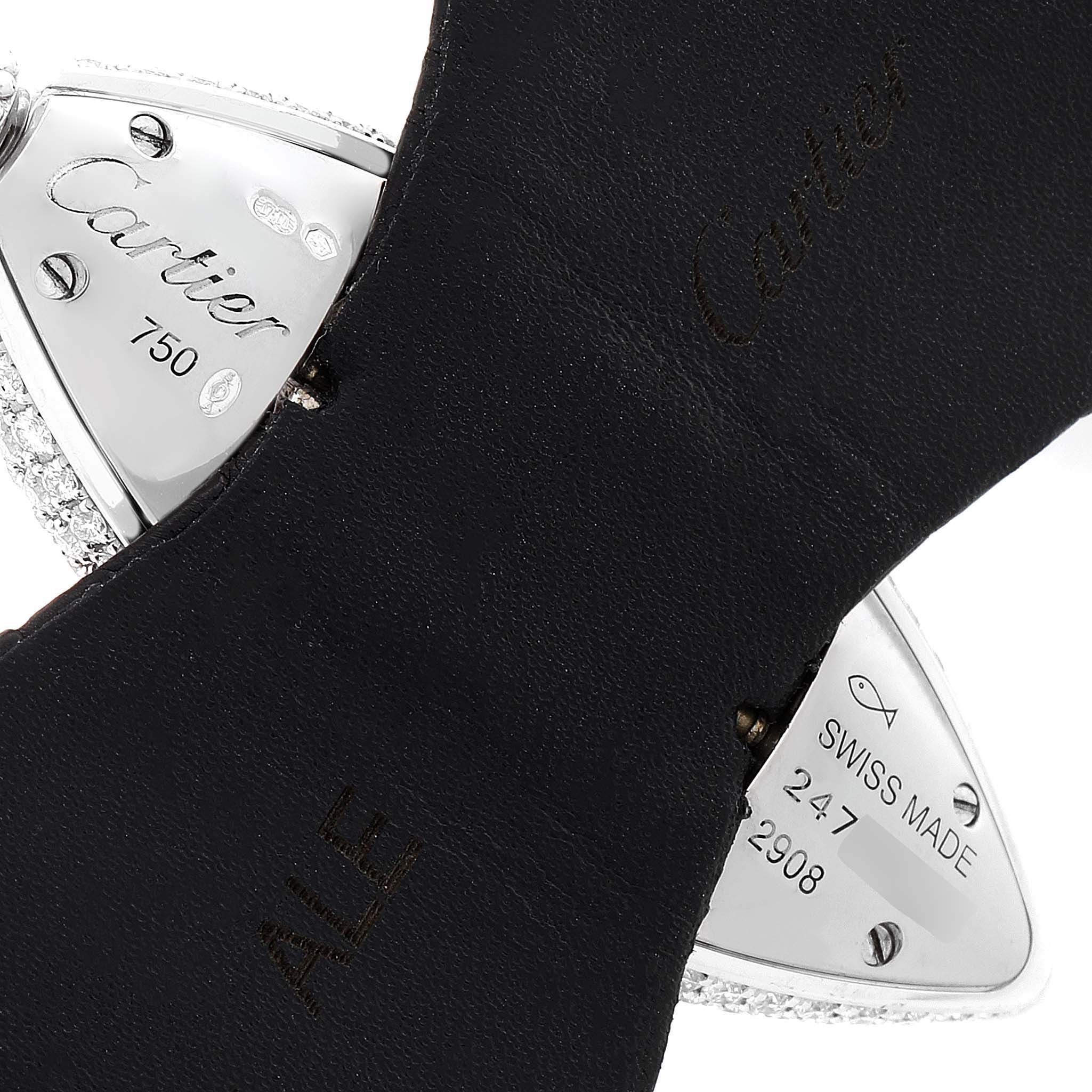 The image shows a close-up of the backside of the strap and case of the Cartier Colisee 2908 Women
s White Gold Silver Dial 2908 Women
s White Gold Silver Dial watch, highlighting brand engravings and serial information.
