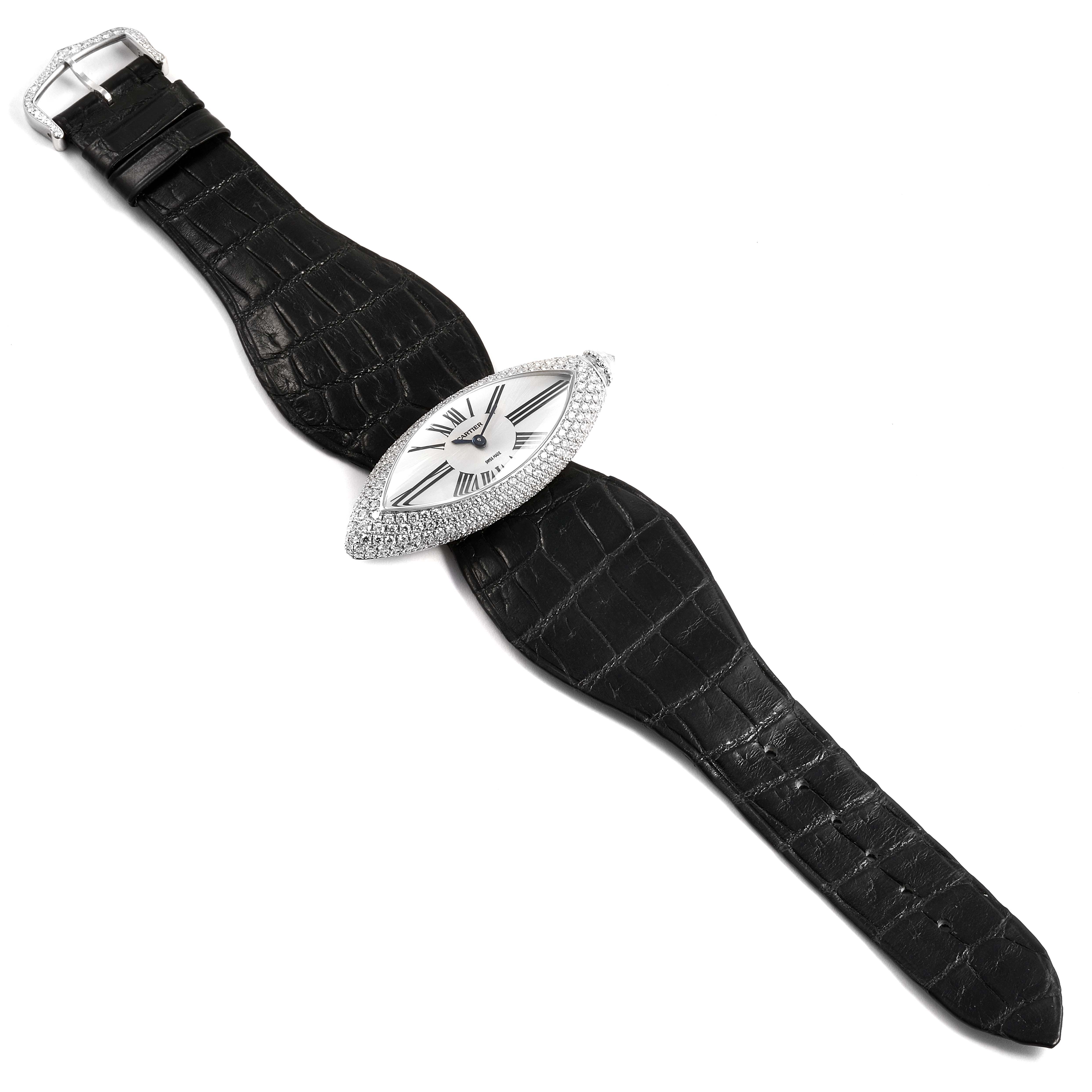 The image shows the top view of a Cartier Colisée watch, highlighting its strap and diamond-studded oval case.