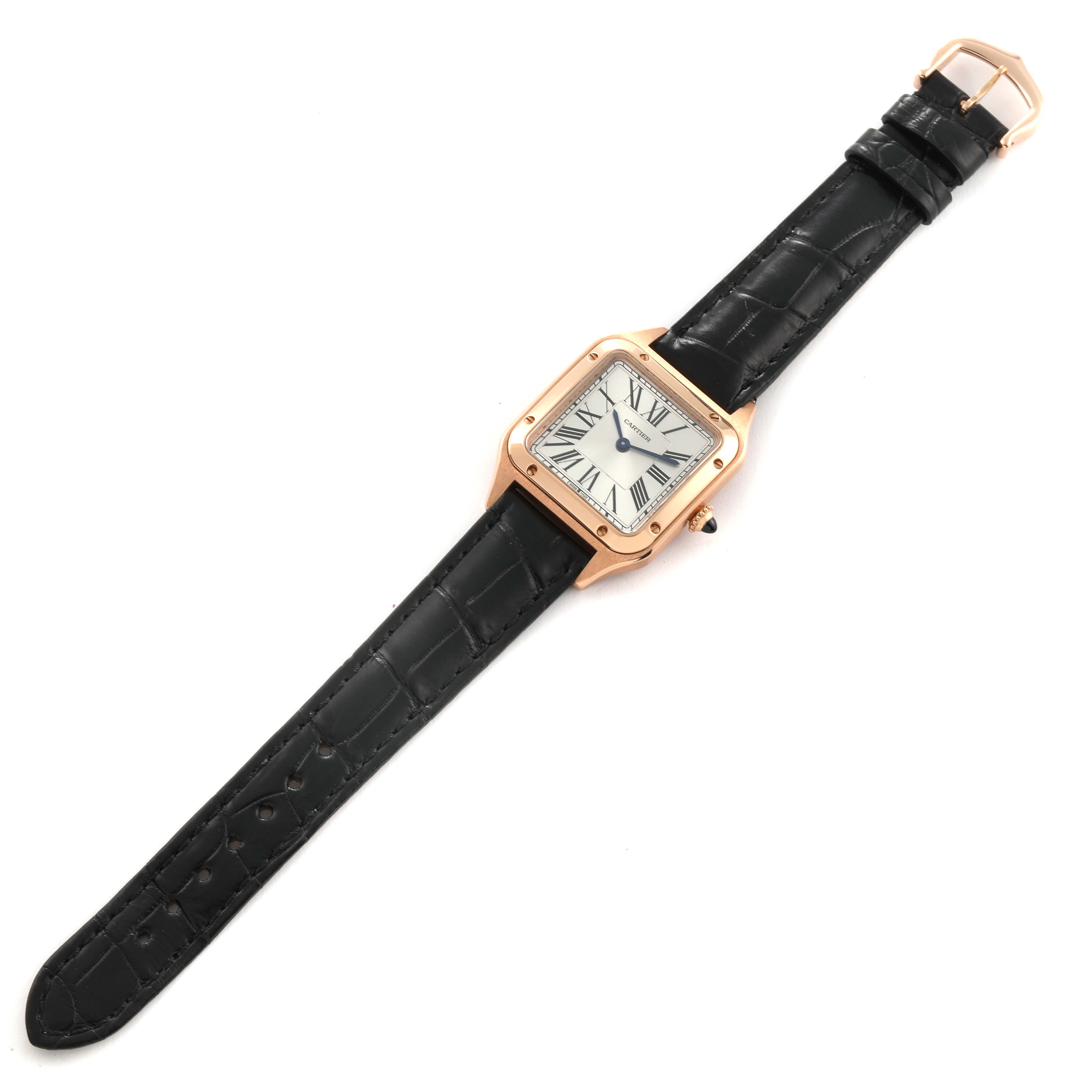 The image shows a Cartier Santos Dumont WGSA0022 Men
s Rose Gold Silver Dial WGSA0022 Men
s Rose Gold Silver Dial watch from a top-down angle, displaying the entire watch including the face, case, and strap.