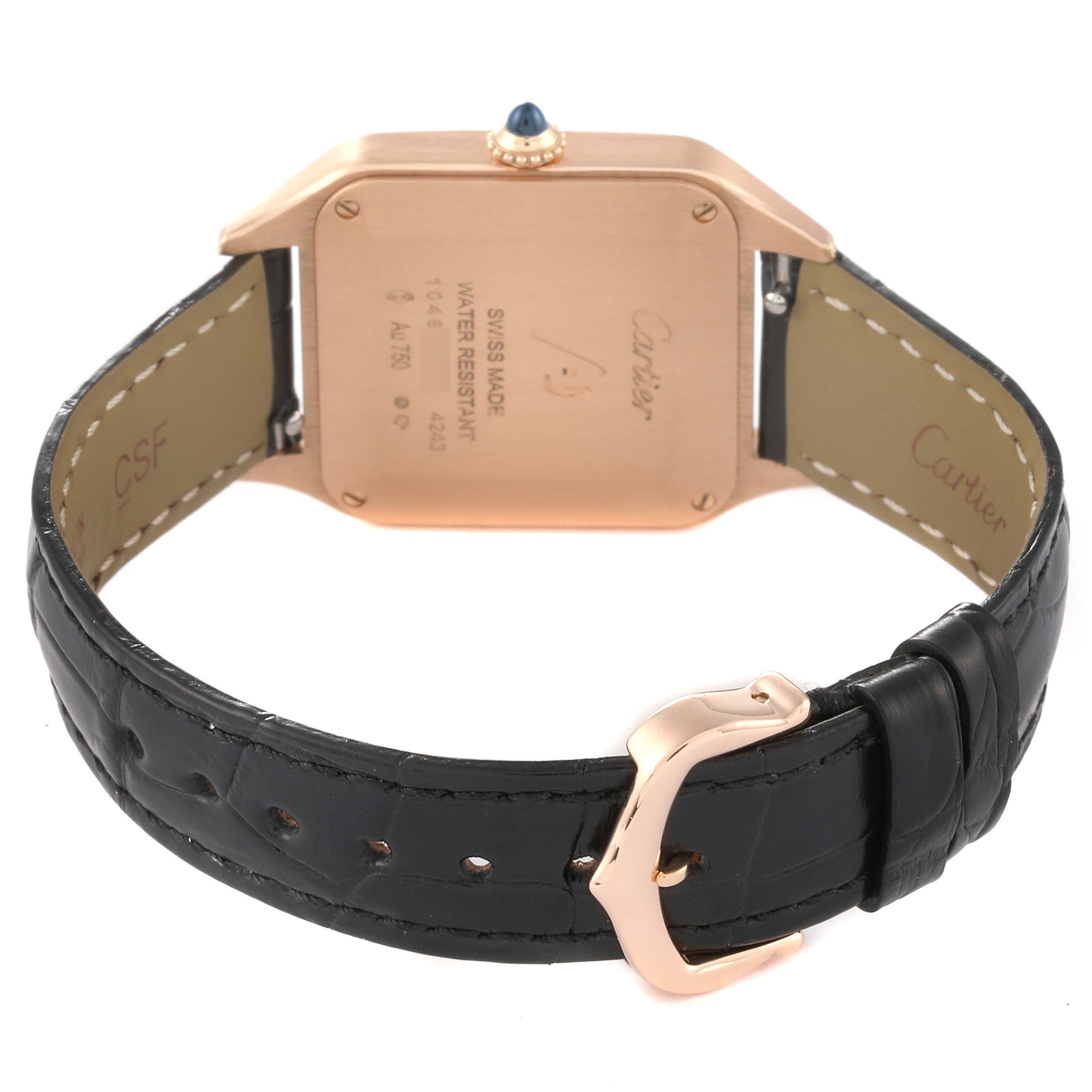 The image shows the back view of the Cartier Santos Dumont WGSA0022 Men
s Rose Gold Silver Dial WGSA0022 Men
s Rose Gold Silver Dial model watch, highlighting its case back and black leather strap with a gold buckle.