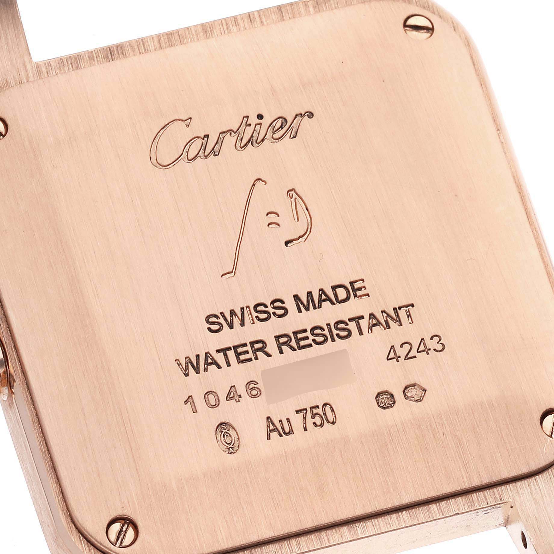 The image shows the back case of a Cartier Santos Dumont WGSA0022 Men
s Rose Gold Silver Dial WGSA0022 Men
s Rose Gold Silver Dial watch, featuring engraving and markings.