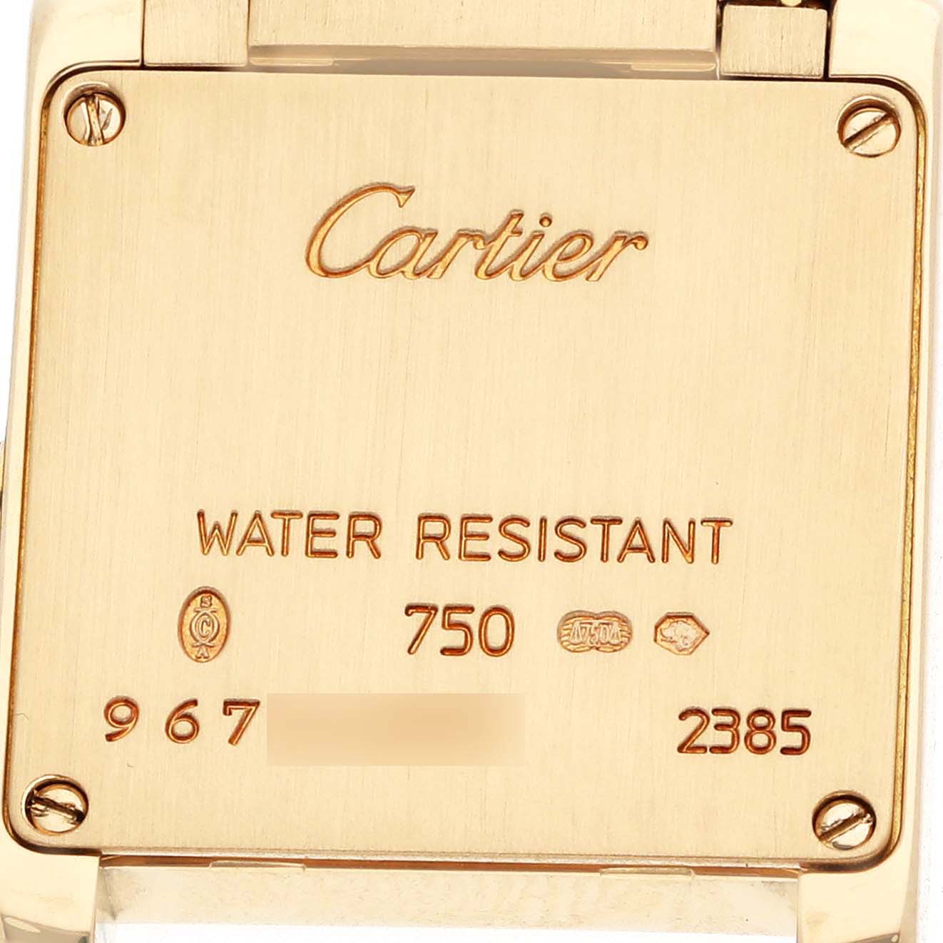 The image shows the back of a Cartier Tank Française watch, displaying the brand name, model details, and water resistance information.