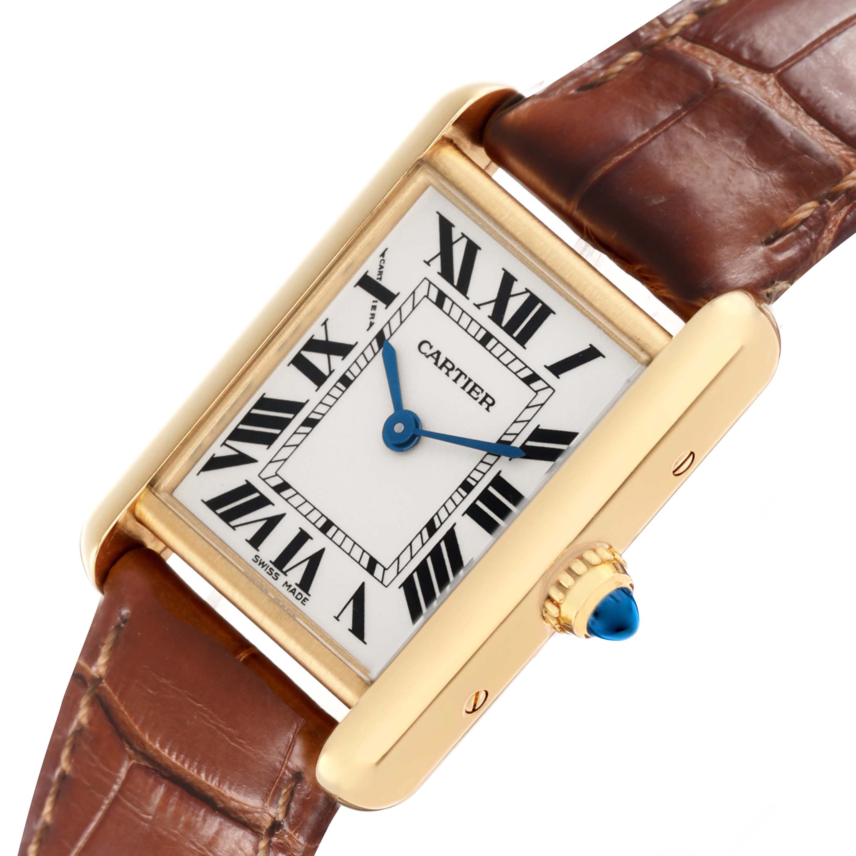 The Cartier Tank Louis W1529856 Women's Yellow Gold Silver Dial watch is shown at an angle highlighting the face, Roman numerals, blue hands, and brown leather strap.