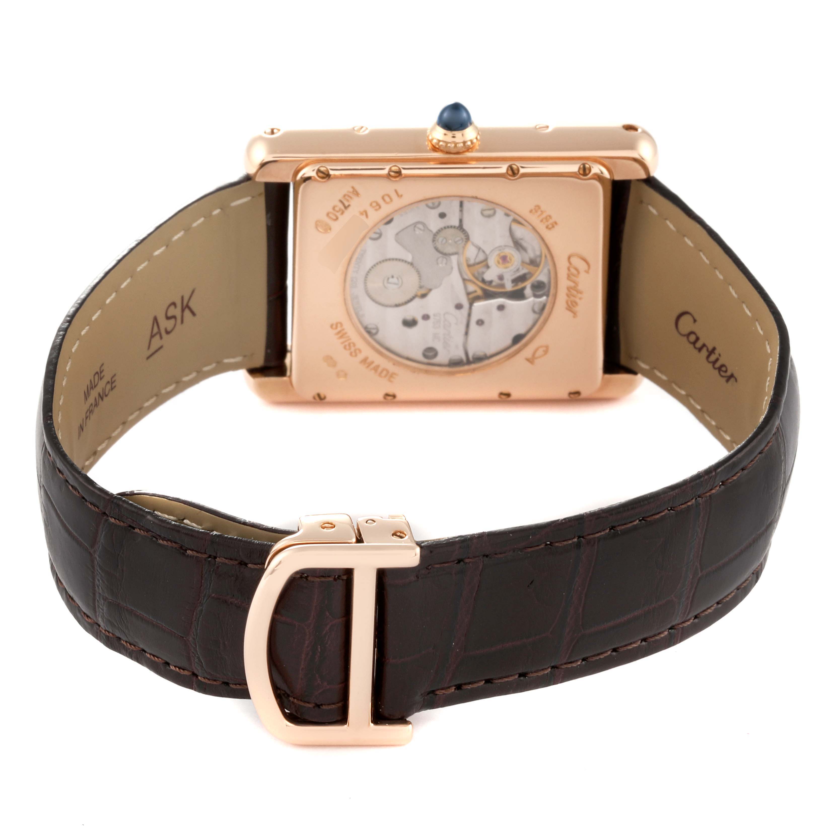 The image shows the back view of a Cartier Tank Louis W1560002 Men's Rose Gold Brown Dial W1560002 Men's Rose Gold Brown Dial watch, highlighting its mechanical movement and leather strap.