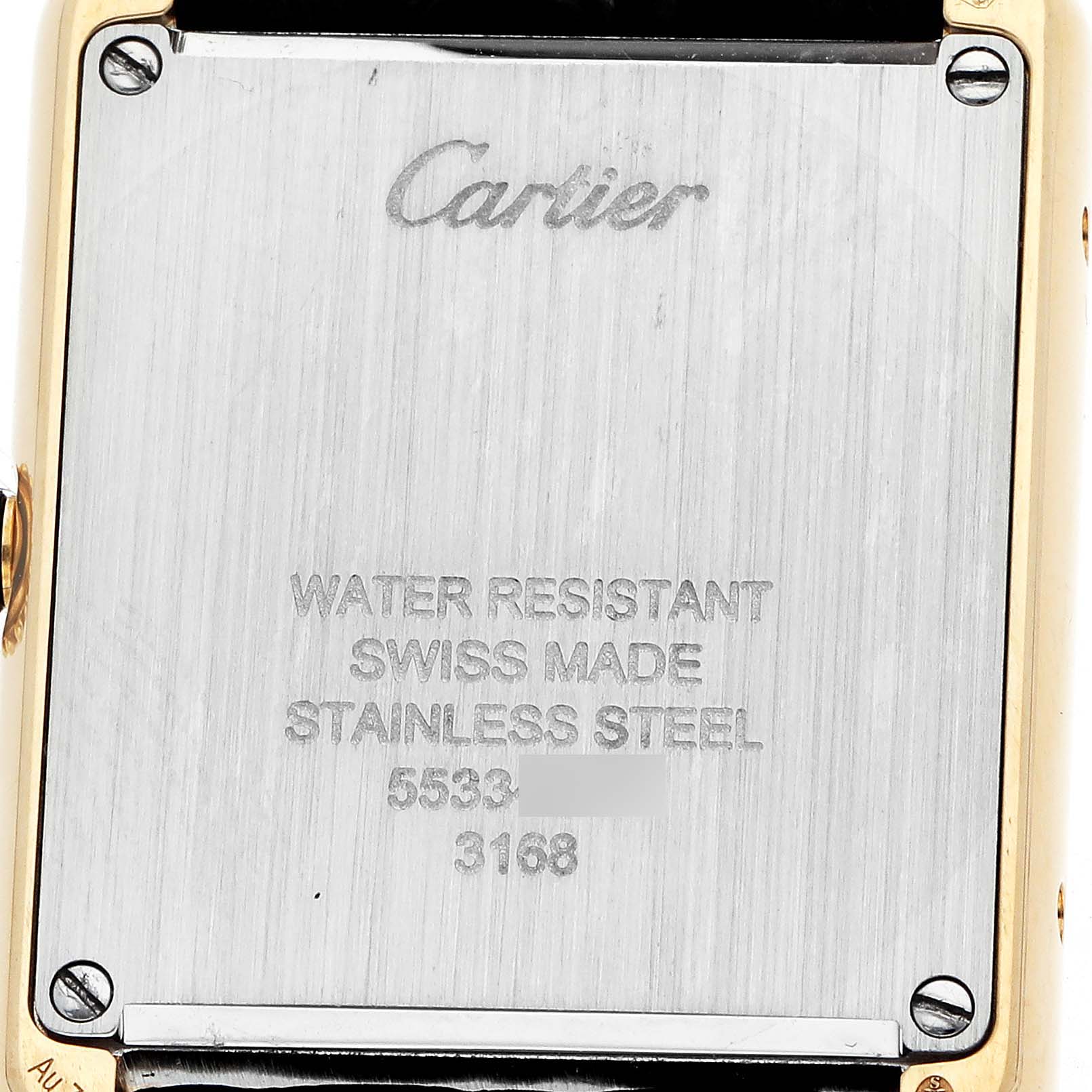 This image shows the back of a Cartier Tank Solo W5200002 Women's Steel and Gold (two tone) Silver Dial watch, highlighting the brand engraving and specifications.