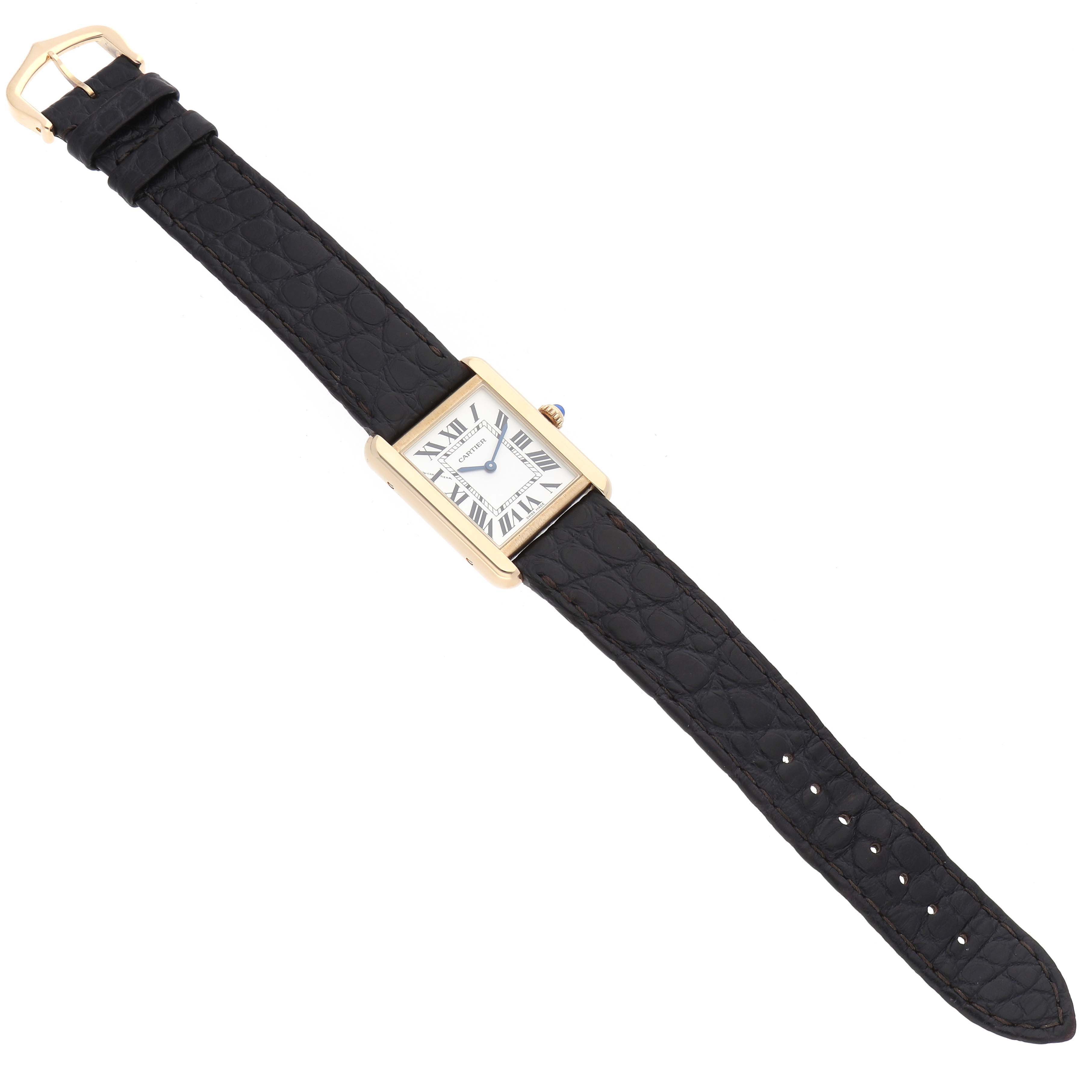 The Cartier Tank Solo W5200002 Women's Steel and Gold (two tone) Silver Dial watch is shown from a top-down angle, displaying its face, black leather strap, and gold buckle.
