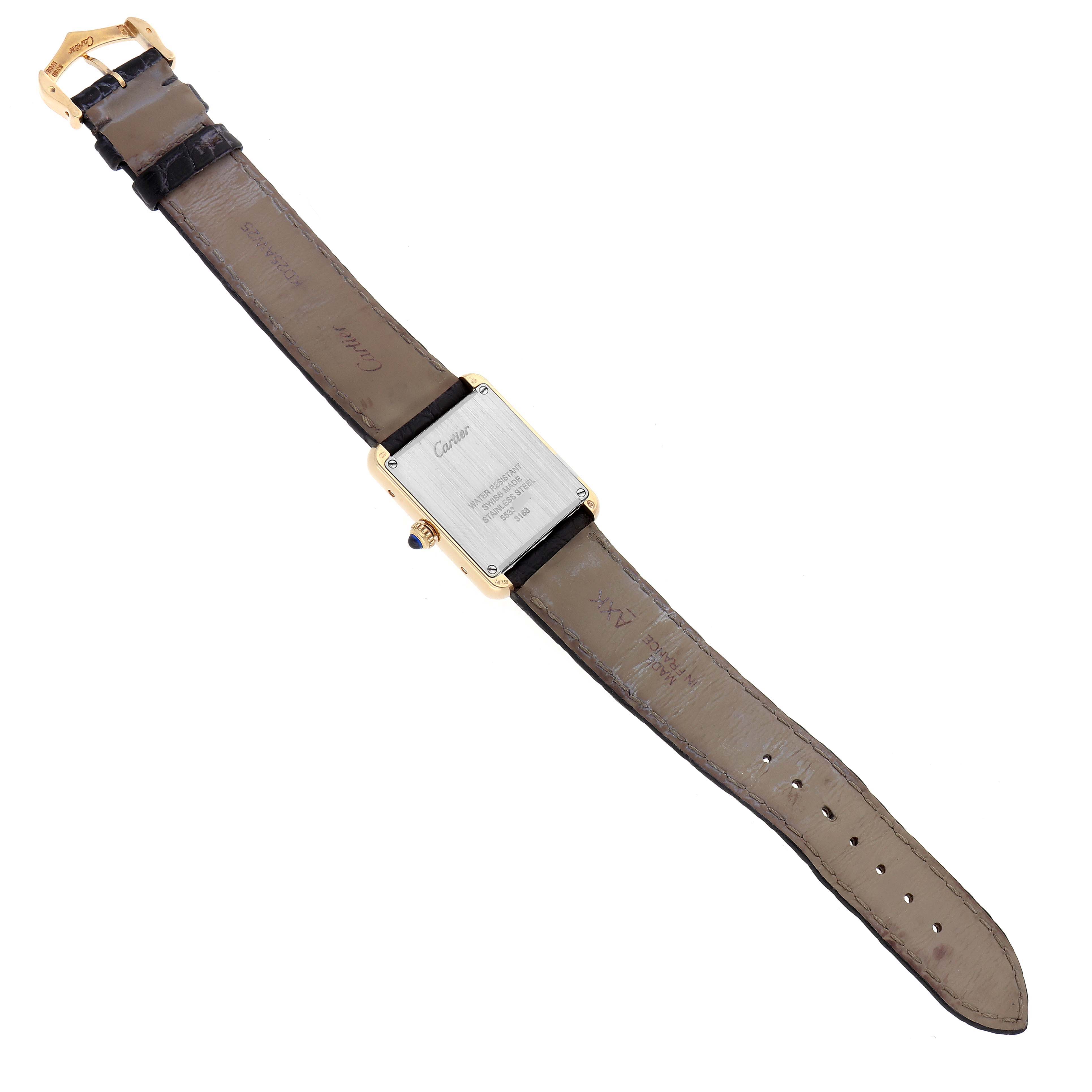 The Cartier Tank Solo W5200002 Women's Steel and Gold (two tone) Silver Dial watch is shown from the back, displaying the case back and full leather strap.