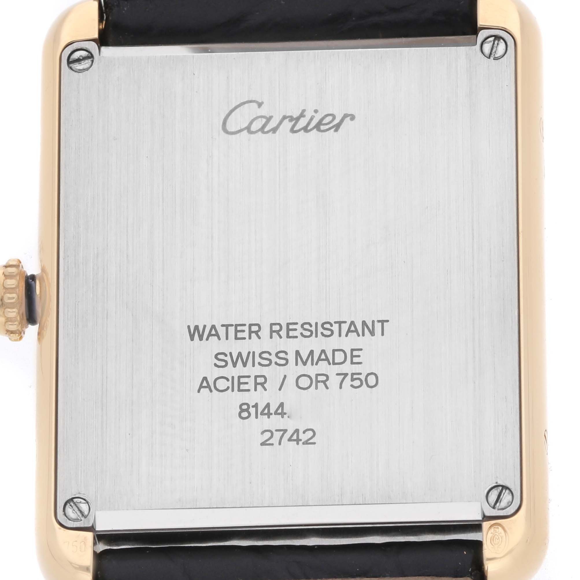 The image shows the back of a Cartier Tank Solo W1018855 Men's Steel and Gold (two tone) Silver Dial watch, highlighting its engravings and leather strap attachment.