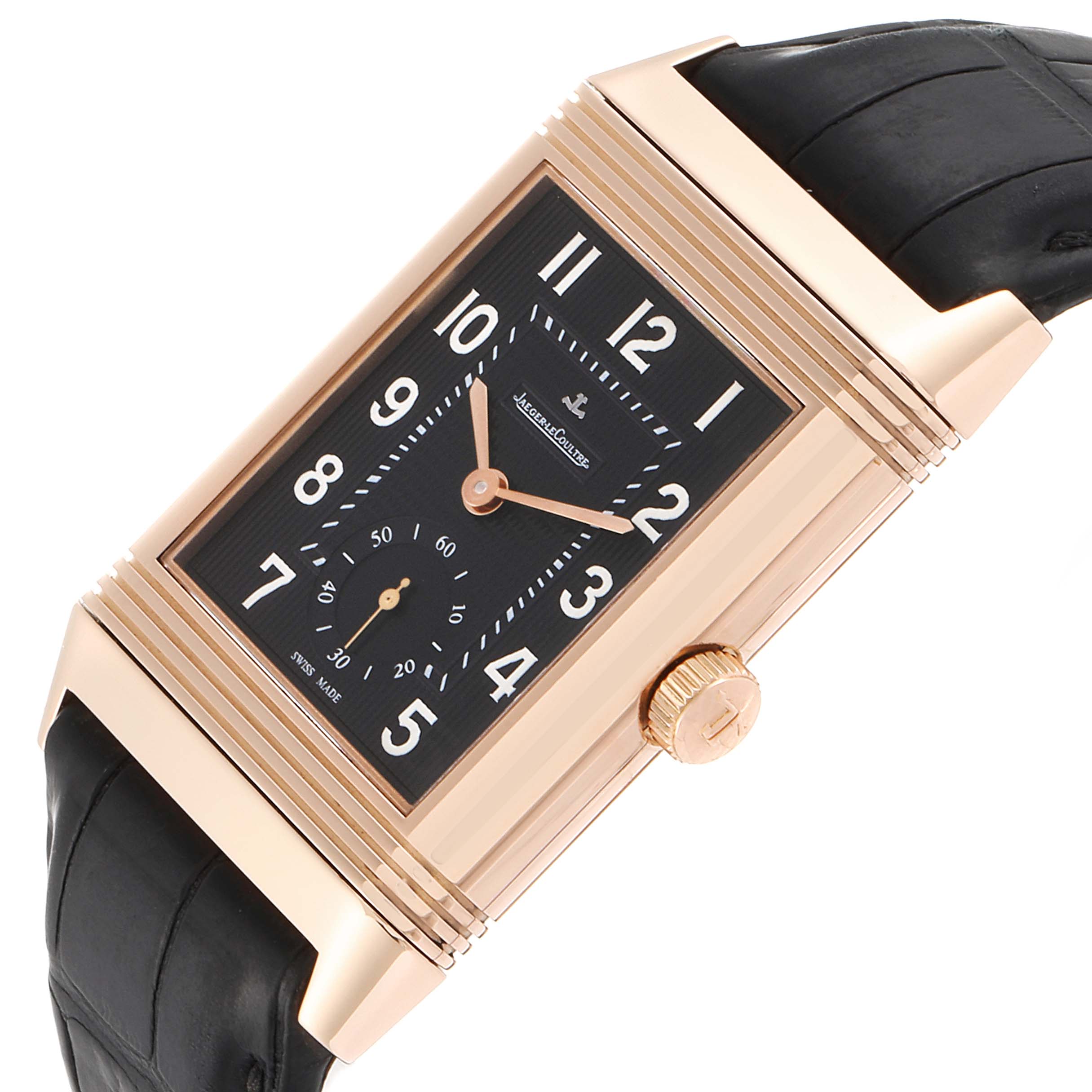 This image displays the Jaeger-LeCoultre Reverso watch at a three-quarter angle, highlighting its rectangular dial, crown, and leather strap.