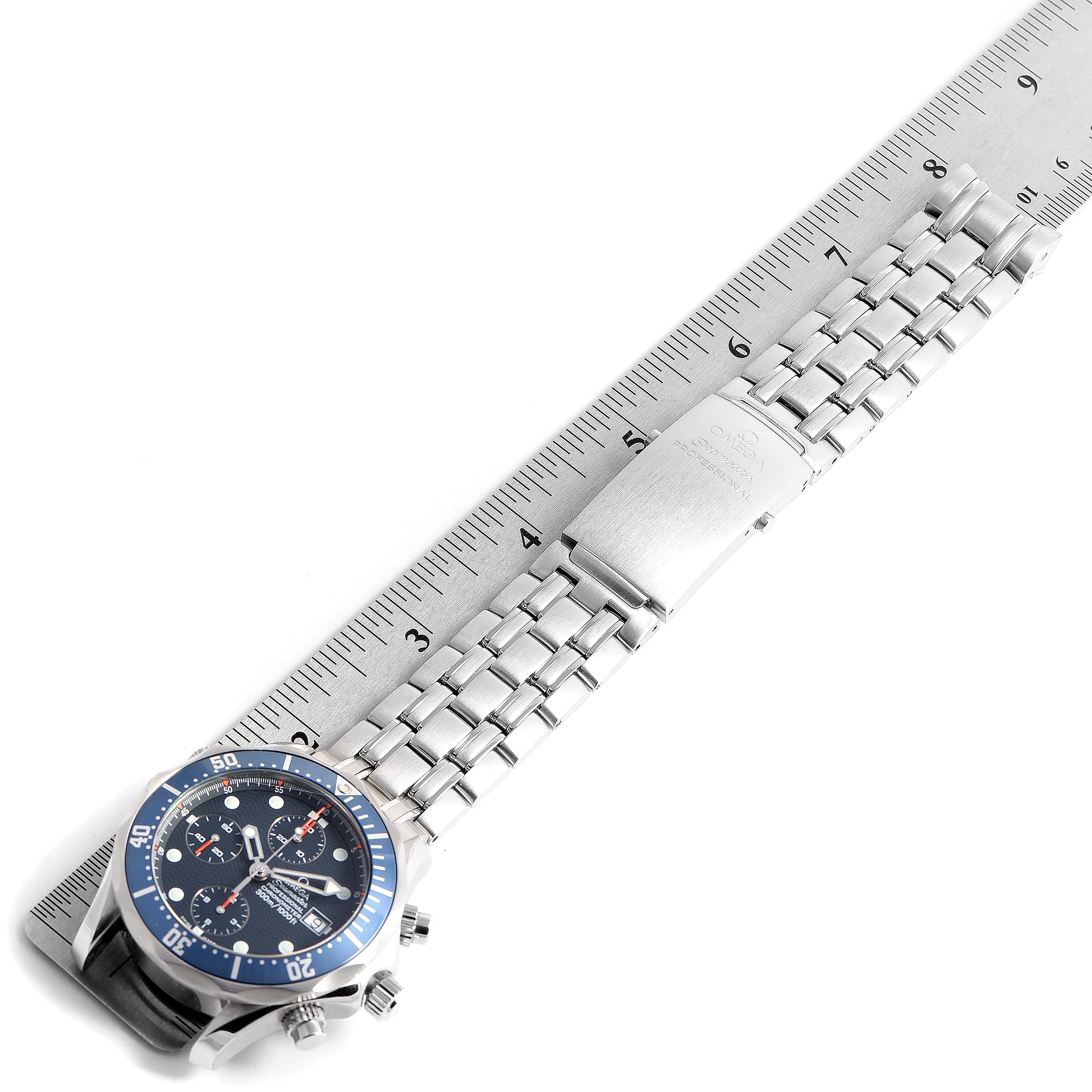 The image shows an Omega Seamaster 2599.80.00 Men
s Stainless Steel Blue Dial 2599.80.00 Men
s Stainless Steel Blue Dial watch laying flat with its stainless steel bracelet and clasp visible, measured against a ruler.